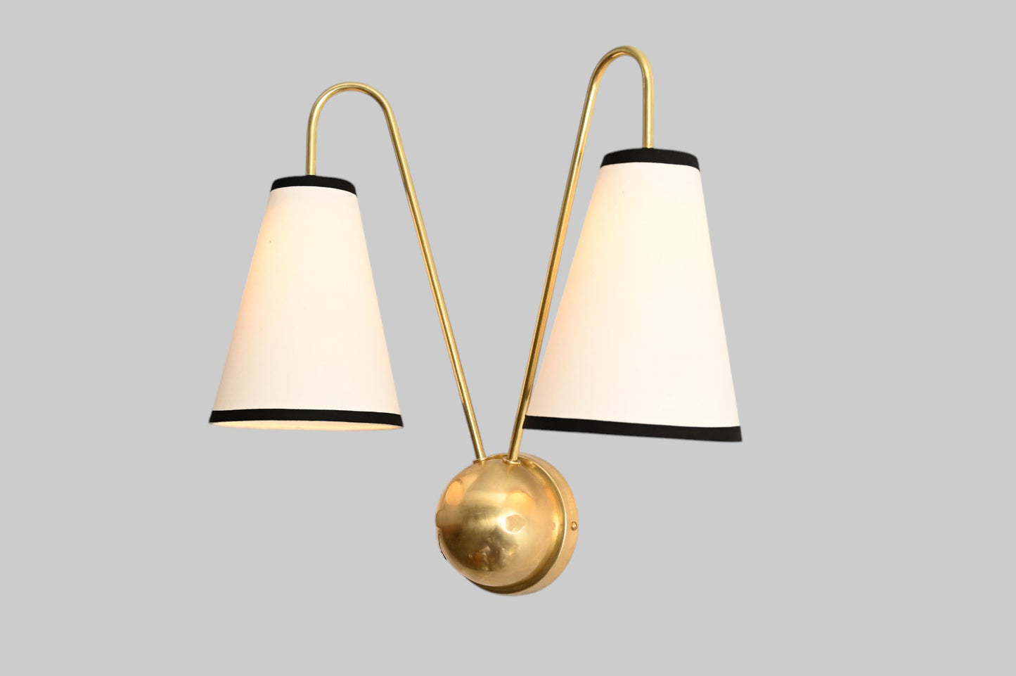 This handcrafted brass chandelier features unique finishes, adding beauty and uniqueness.