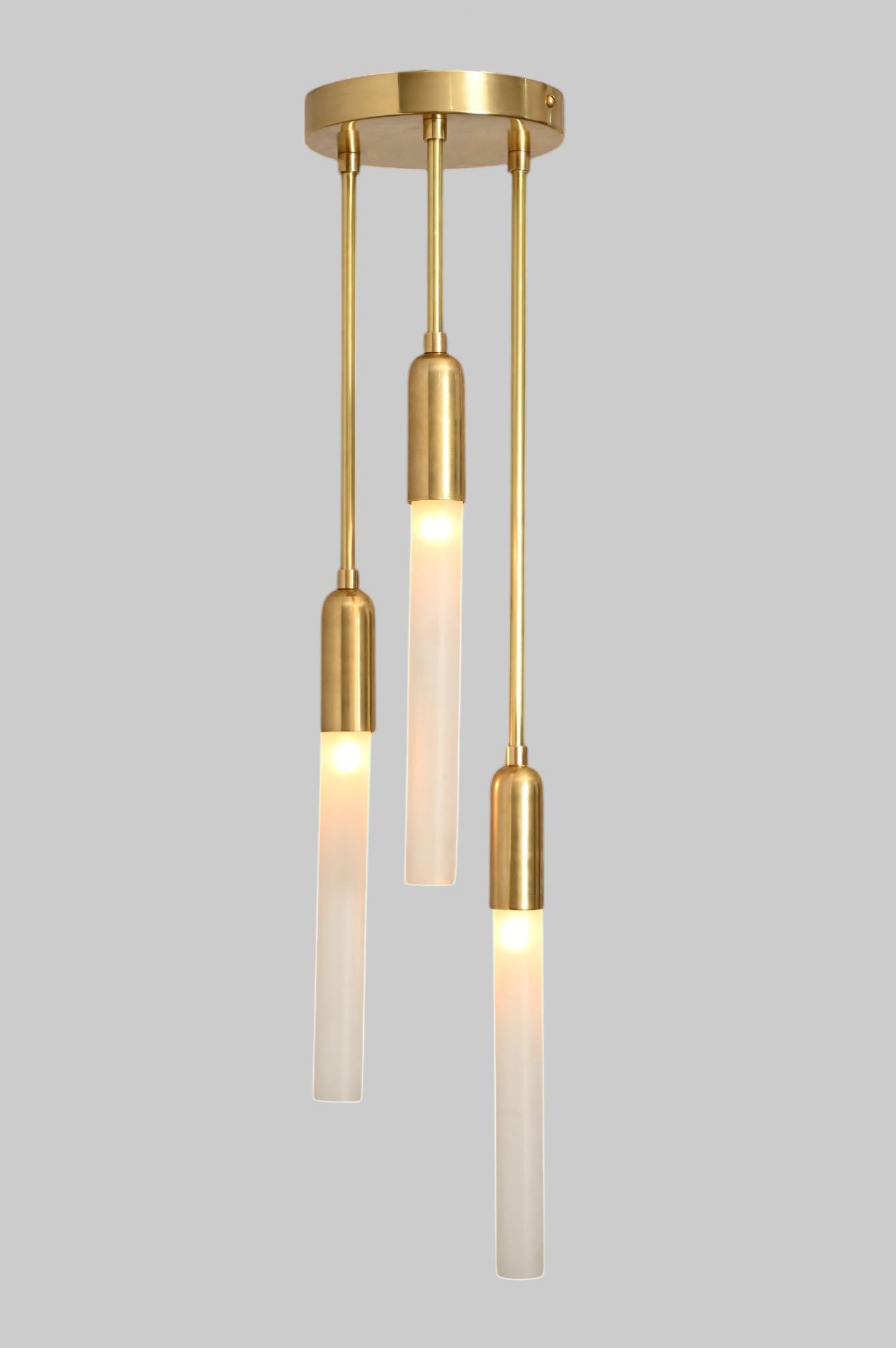 Glass Tube Ceiling Light in Raw Brass blends mid-century design with modern elegance