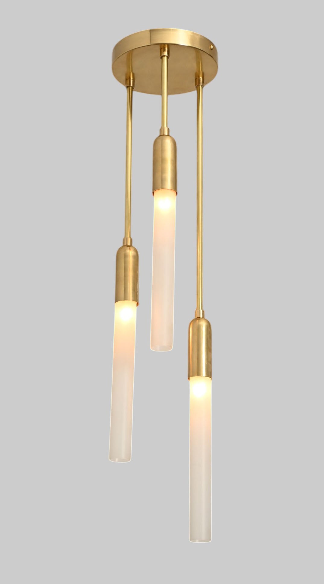 Glass Tube Ceiling Light in Raw Brass blends mid-century design with modern elegance