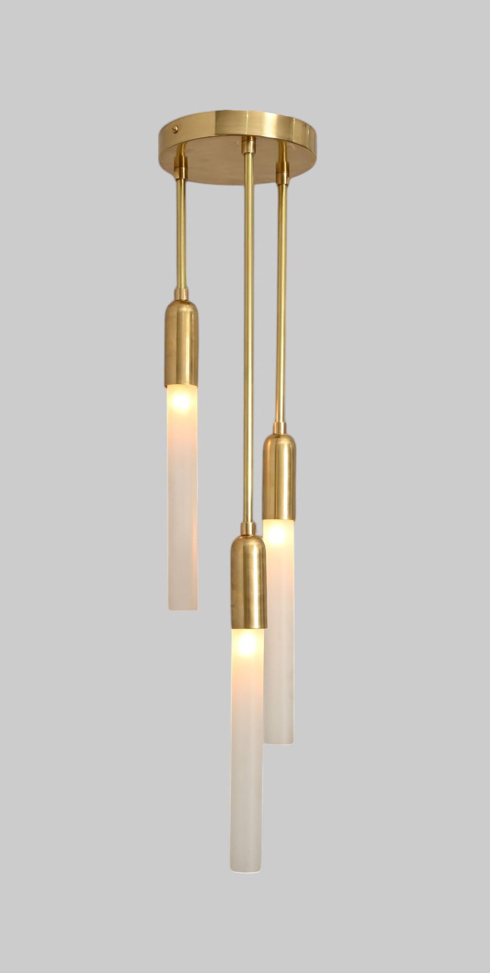 Glass Tube Ceiling Light in Raw Brass blends mid-century design with modern elegance