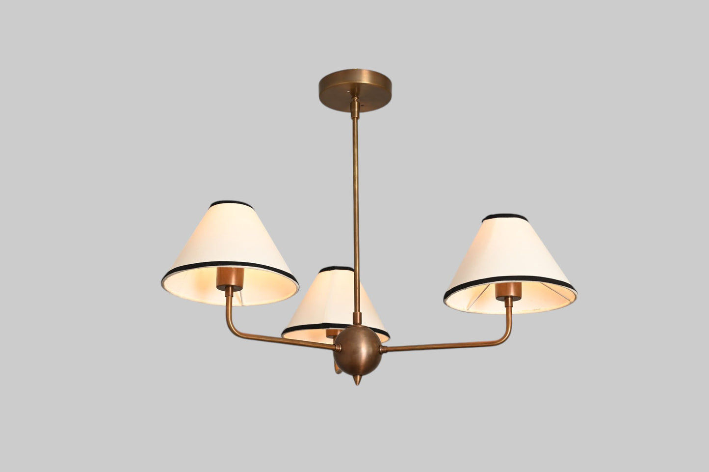 3-shade brass chandelier with unique finish variations for a one-of-a-kind design.