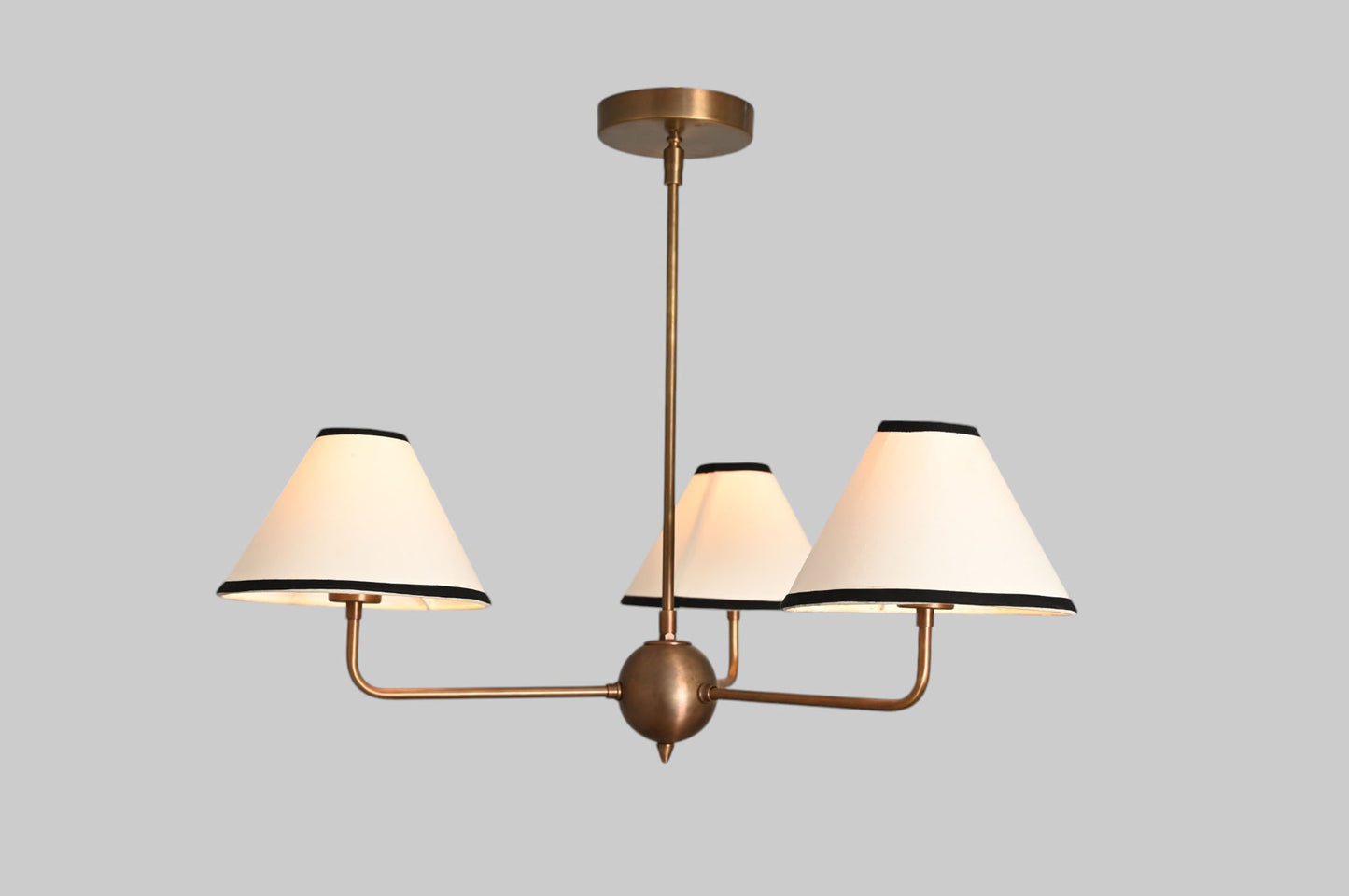 3-shade brass chandelier with unique finish variations for a one-of-a-kind design.