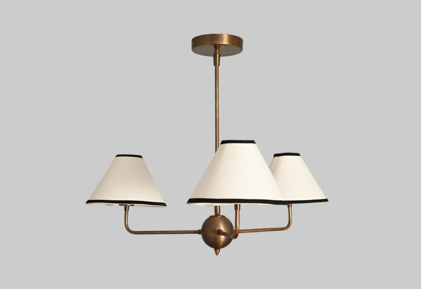 3-shade brass chandelier with unique finish variations for a one-of-a-kind design.