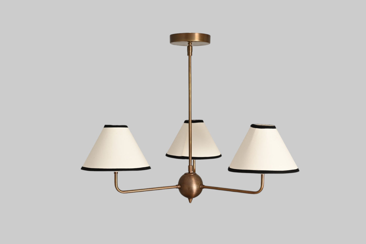 3-shade brass chandelier with unique finish variations for a one-of-a-kind design.