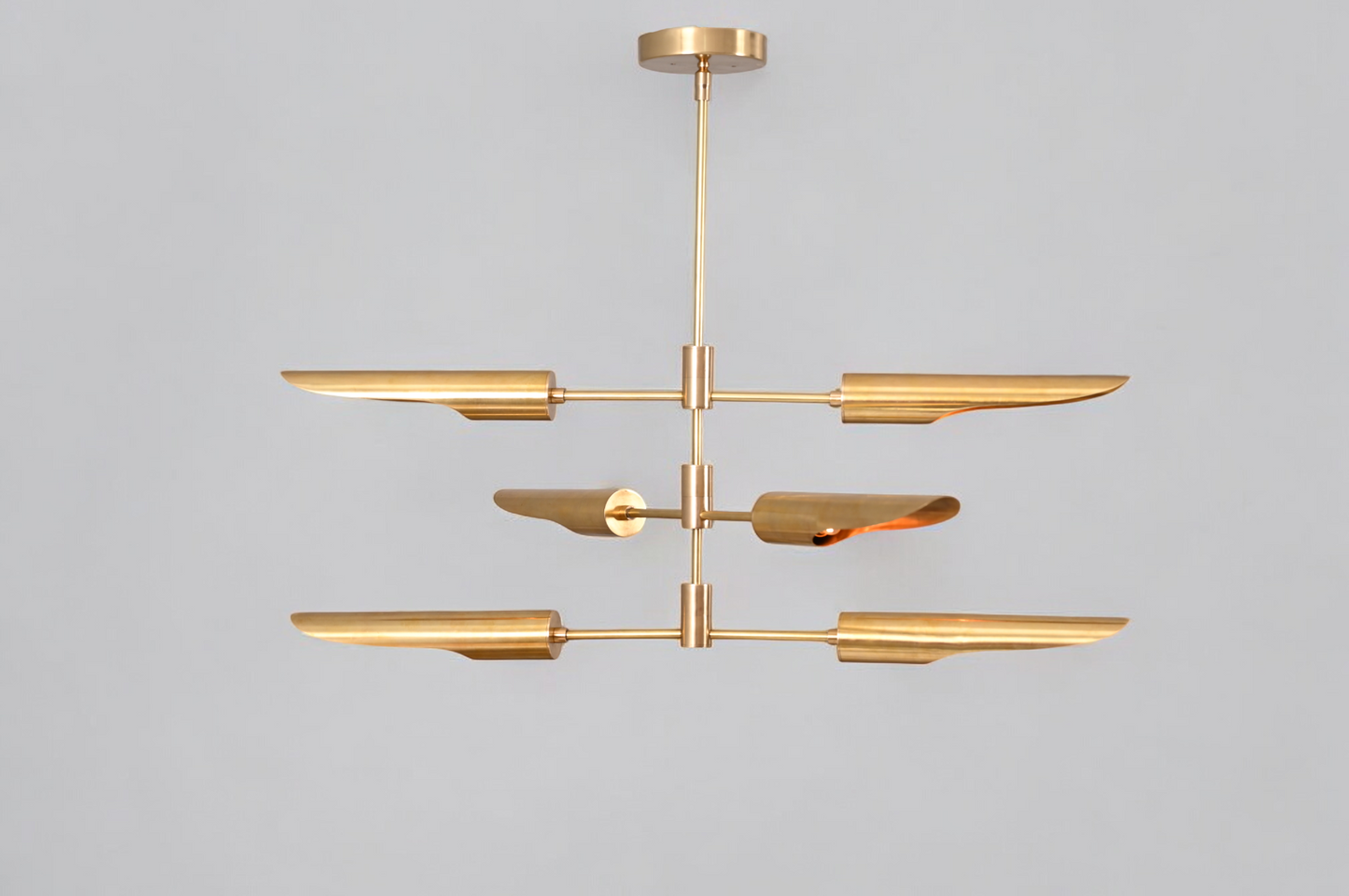 Enhance your decor with the Raw Brass Three Layer Shade Pendant Chandelier