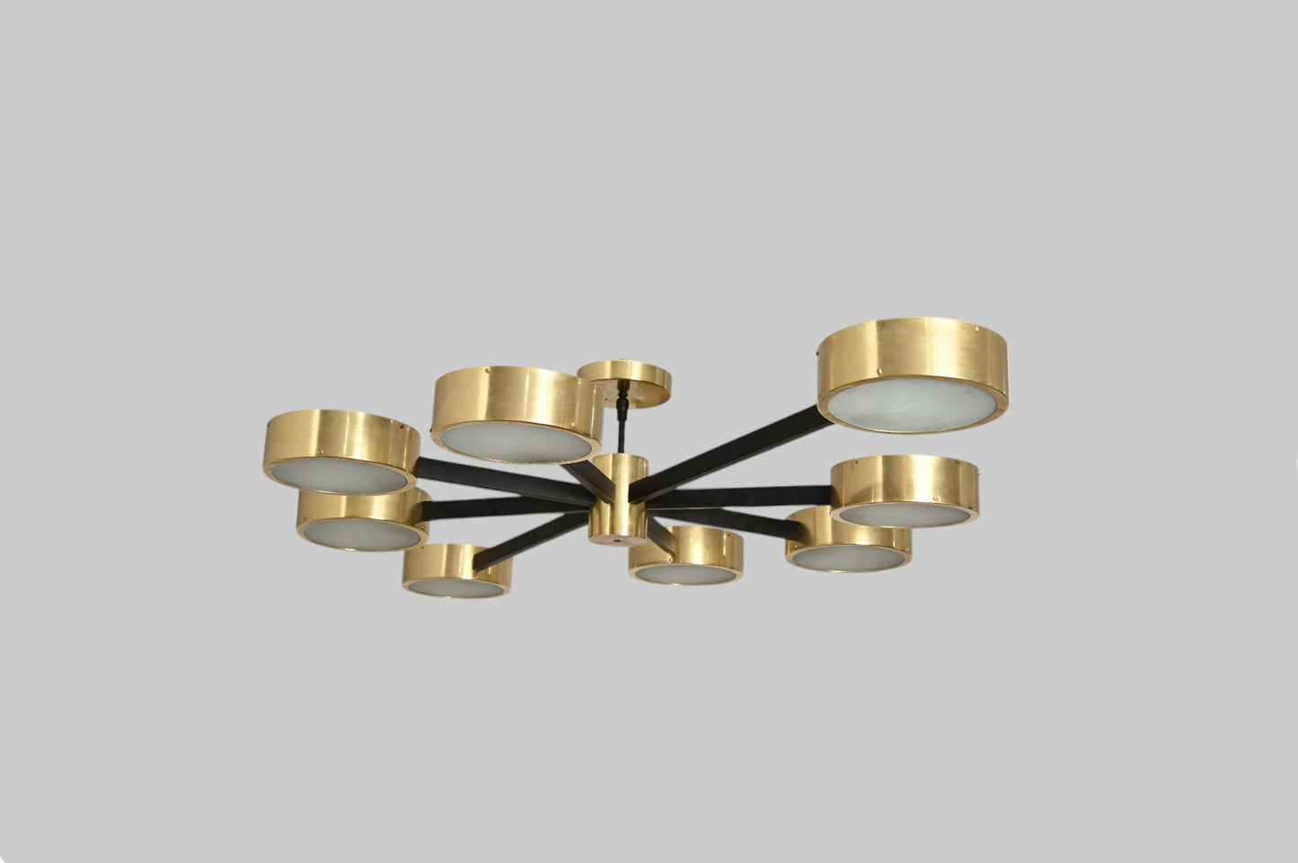 Handcrafted perforated brass chandelier with unique finish variations, full of charm