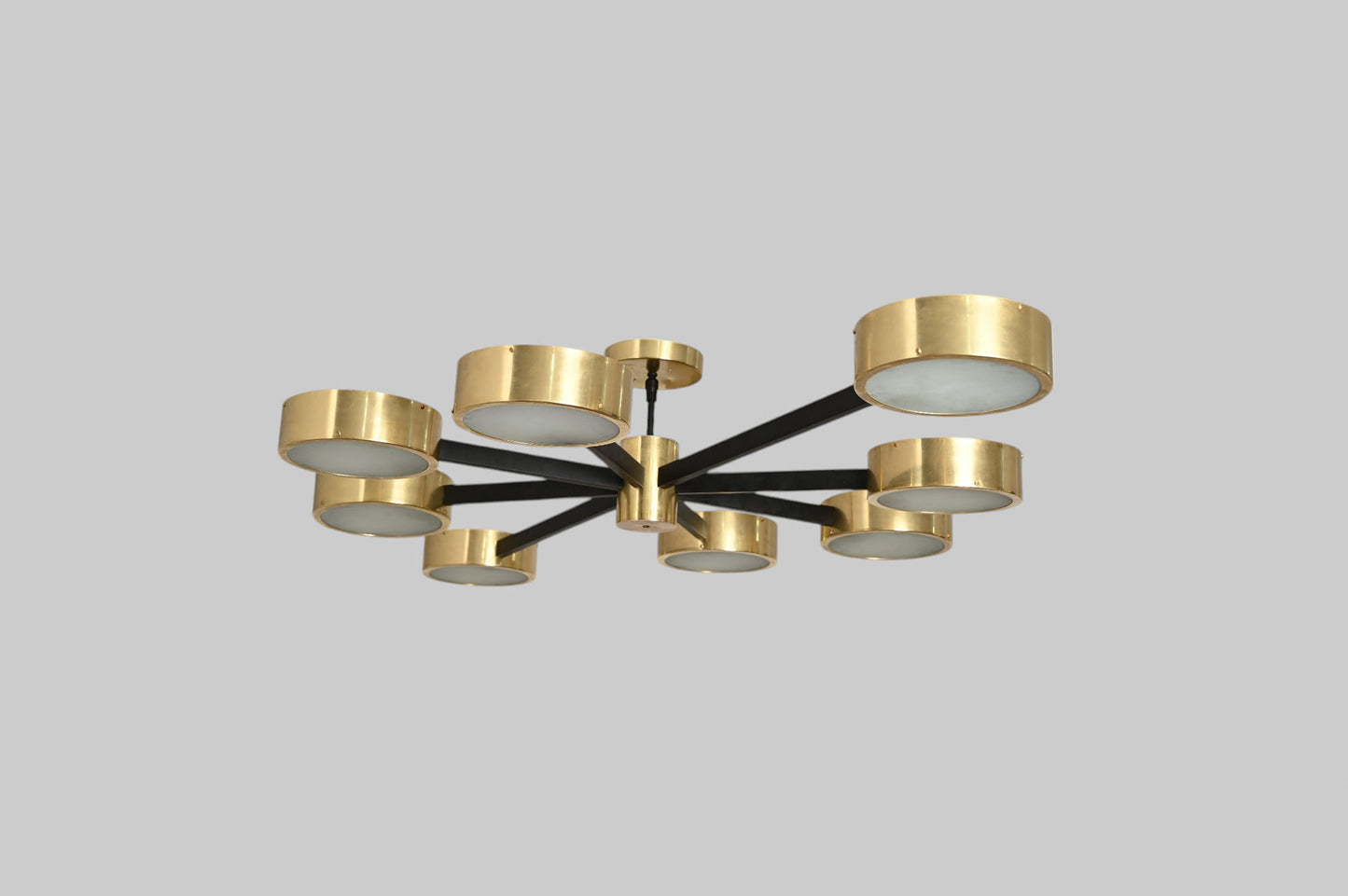 Handcrafted perforated brass chandelier with unique finish variations, full of charm