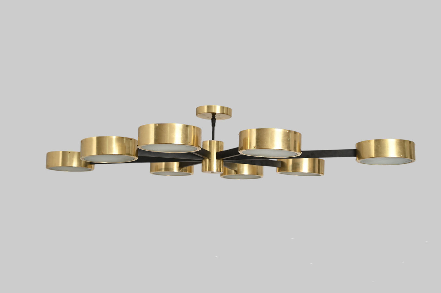 Handcrafted perforated brass chandelier with unique finish variations, full of charm