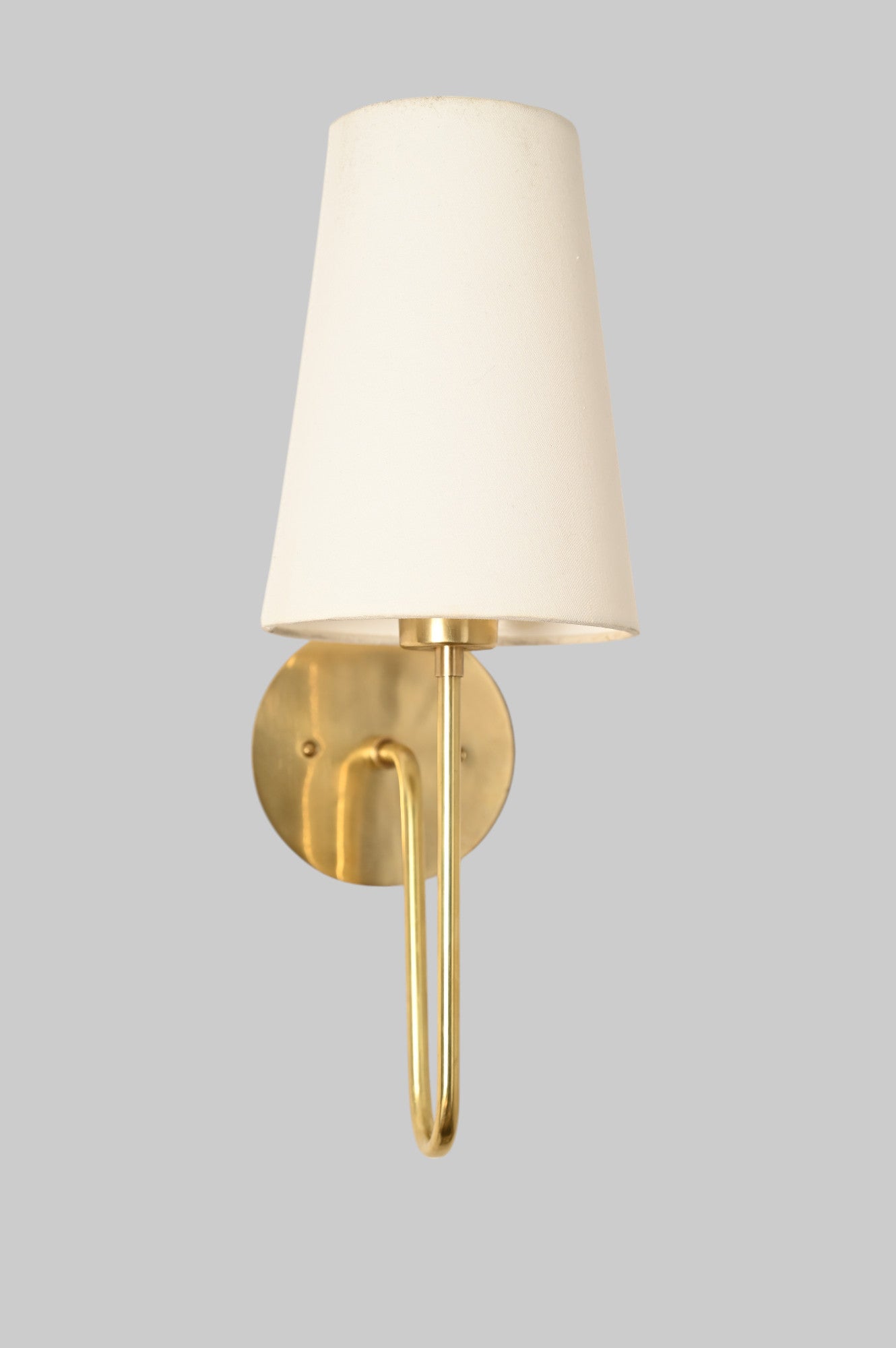 Aged Brass 'Scoop Sconce' offers sleek, stylish lighting with Mid Century design