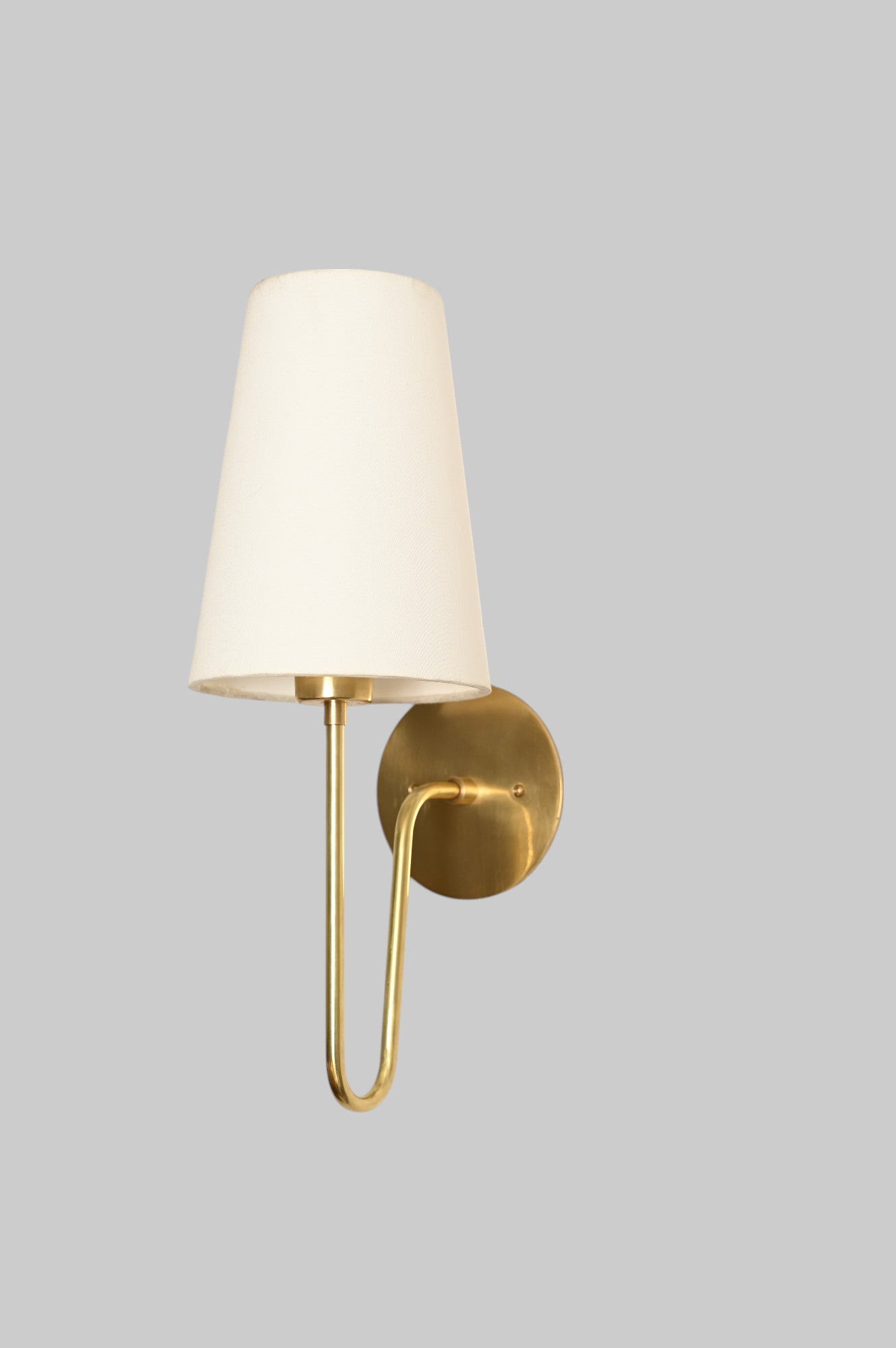 Aged Brass 'Scoop Sconce' offers sleek, stylish lighting with Mid Century design