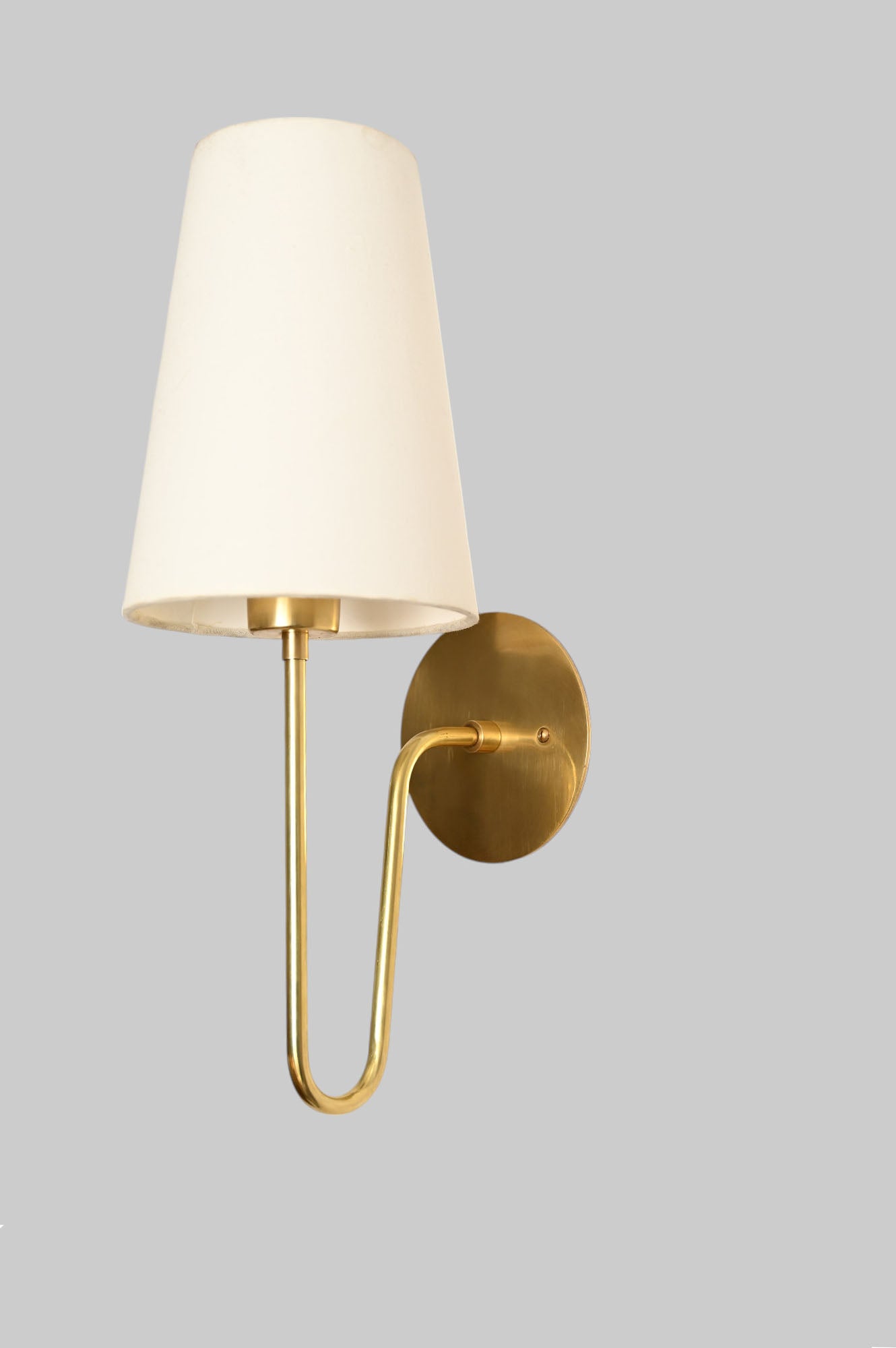 Aged Brass 'Scoop Sconce' offers sleek, stylish lighting with Mid Century design