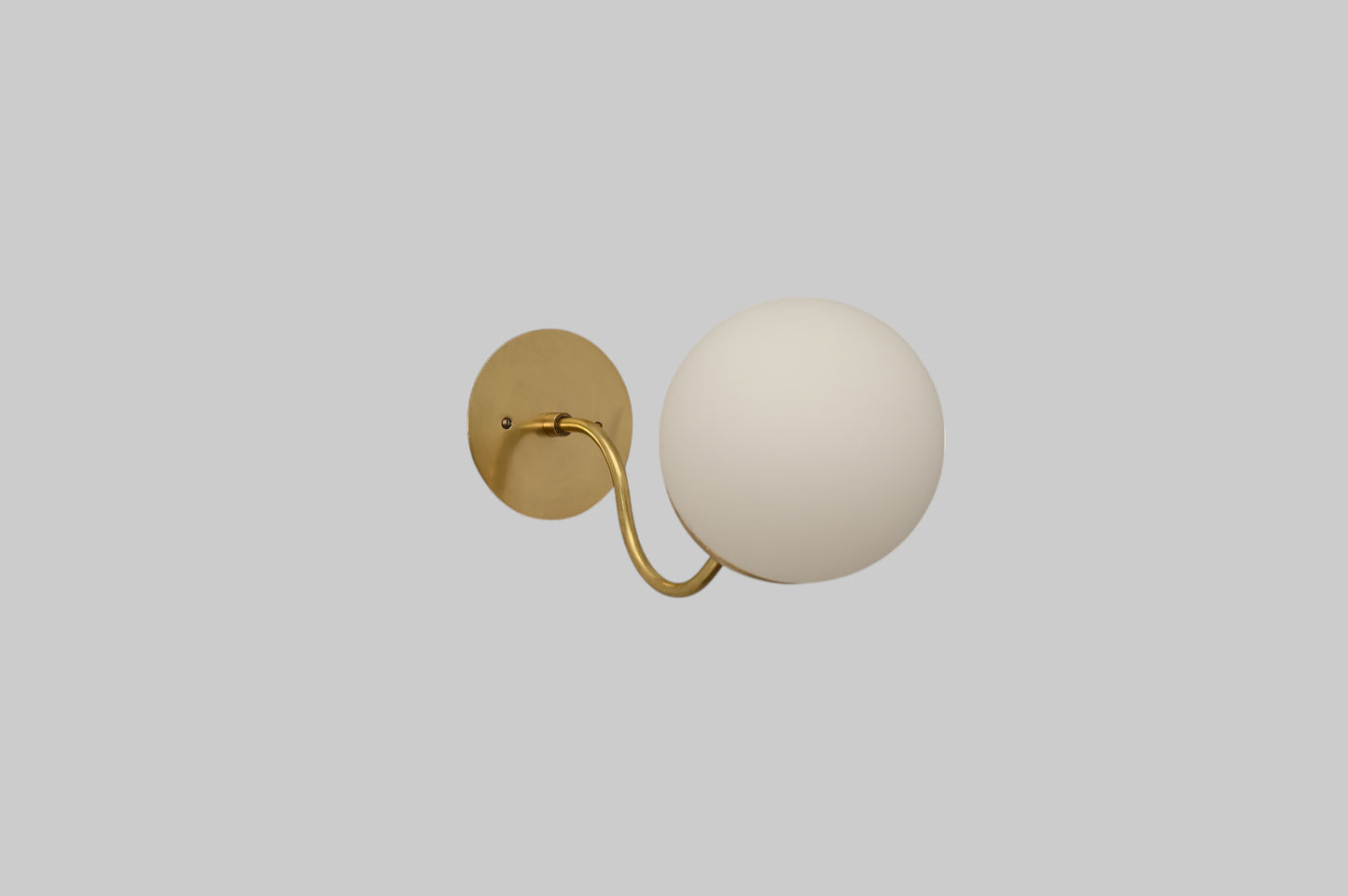 Mid-century modern wall sconces with raw brass finish and Sputnik design, stylish elegance