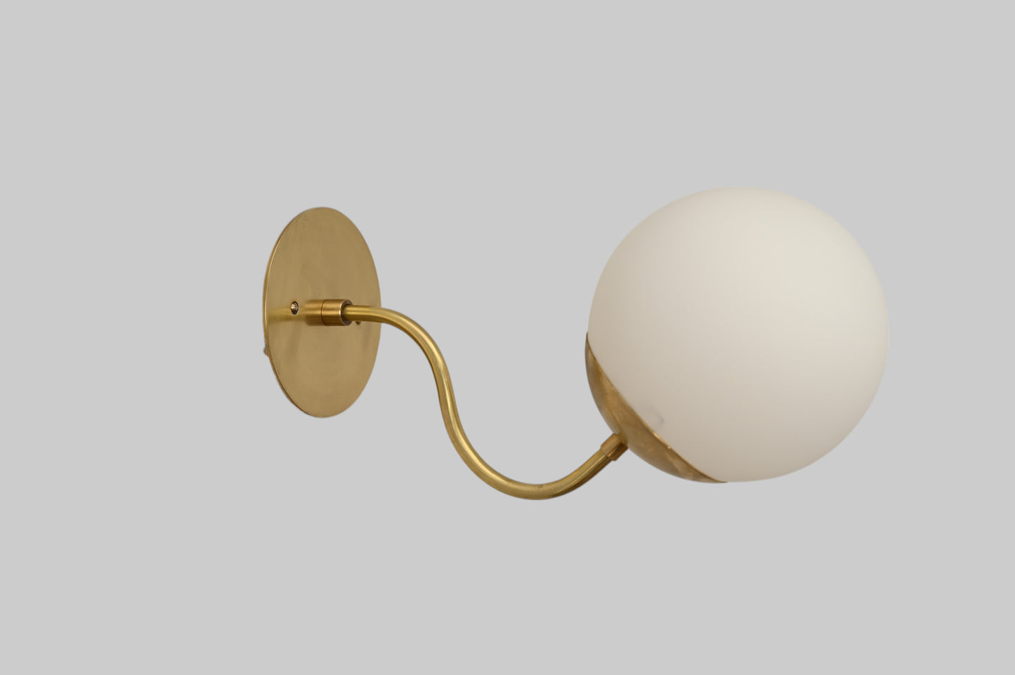 Mid-century modern wall sconces with raw brass finish and Sputnik design, stylish elegance