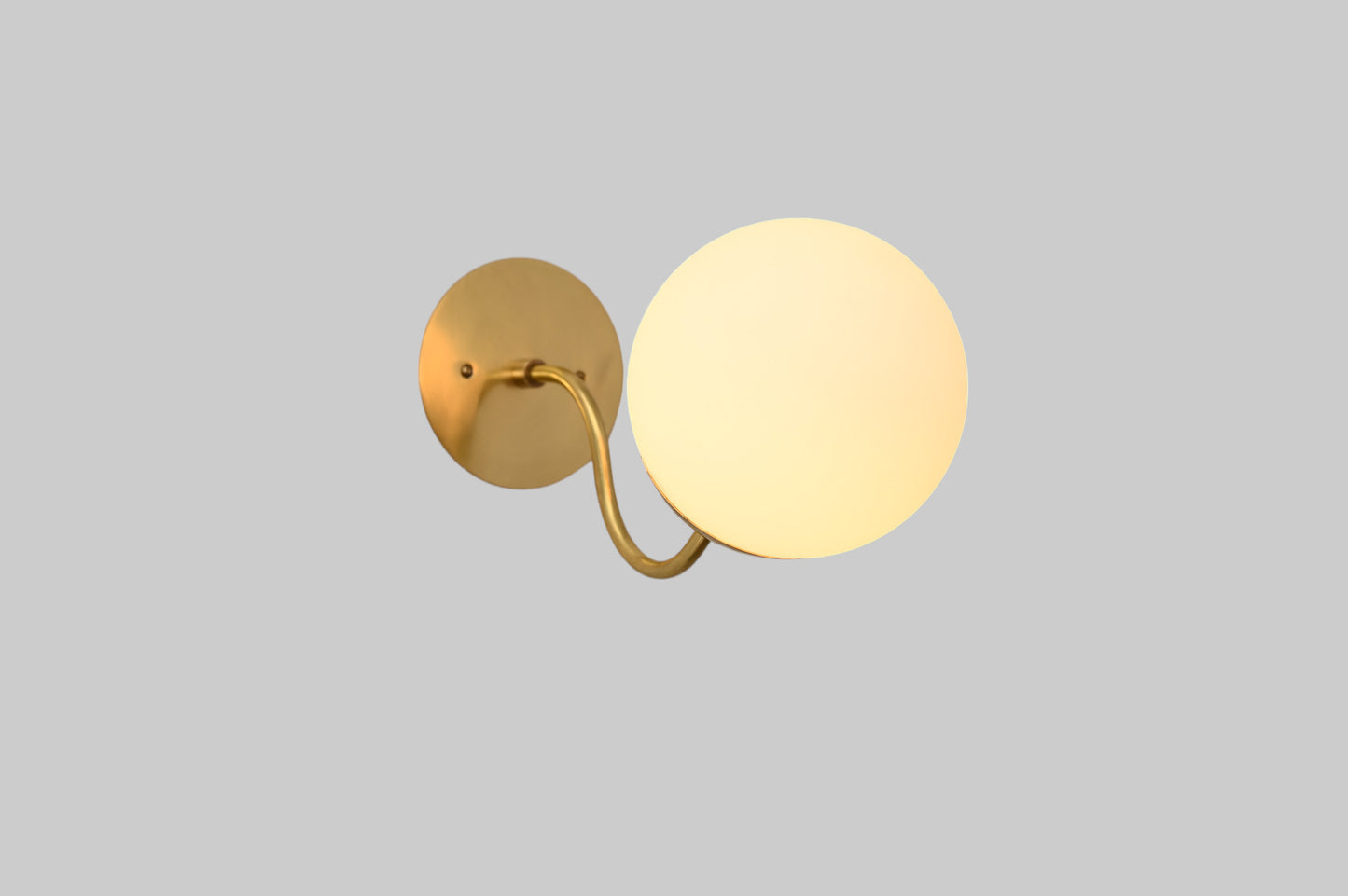 Mid-century modern wall sconces with raw brass finish and Sputnik design, stylish elegance