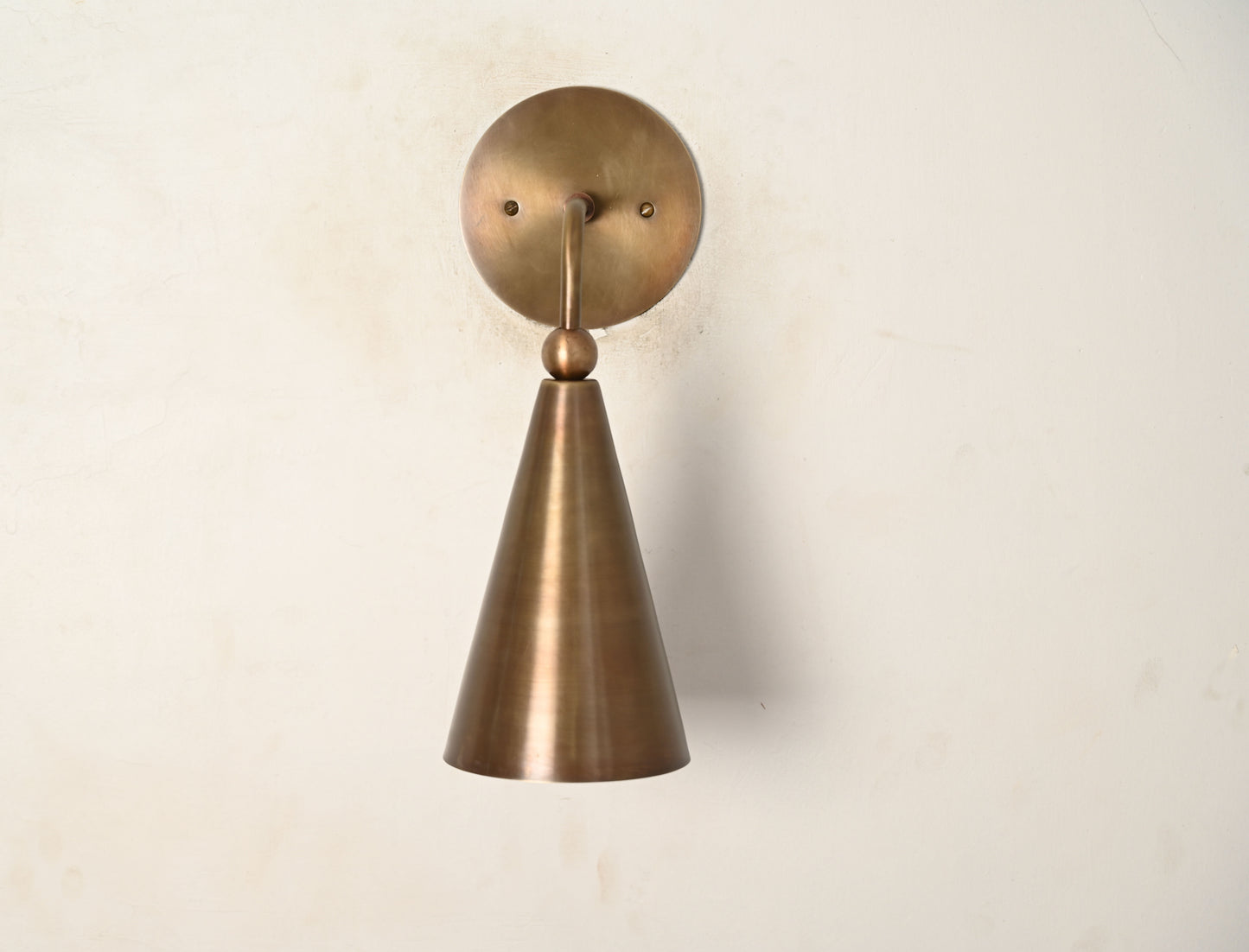 Mid-century modern wall sconces with raw brass finish and Sputnik design, stylish elegance