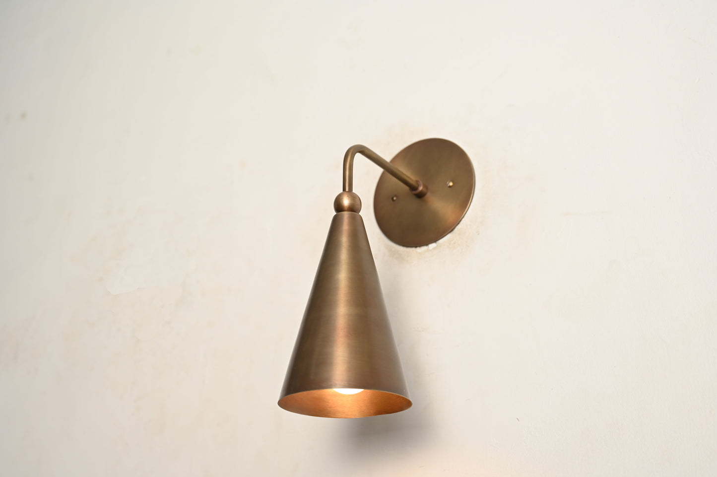 Mid-century modern wall sconces with raw brass finish and Sputnik design, stylish elegance