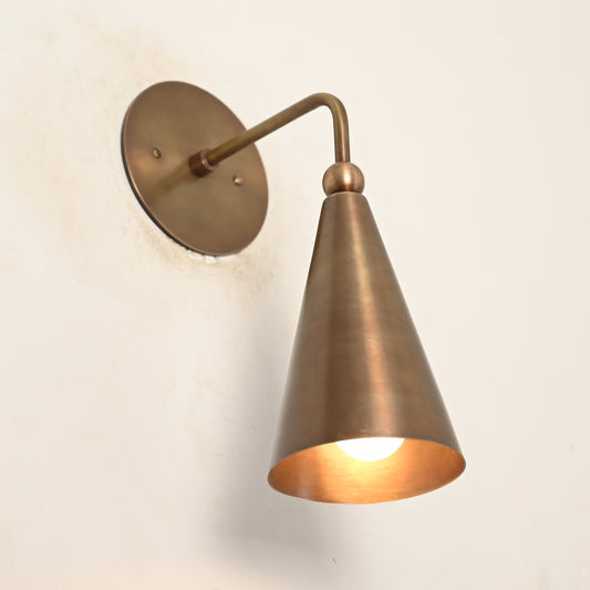 Mid-century modern wall sconces with raw brass finish and Sputnik design, stylish elegance