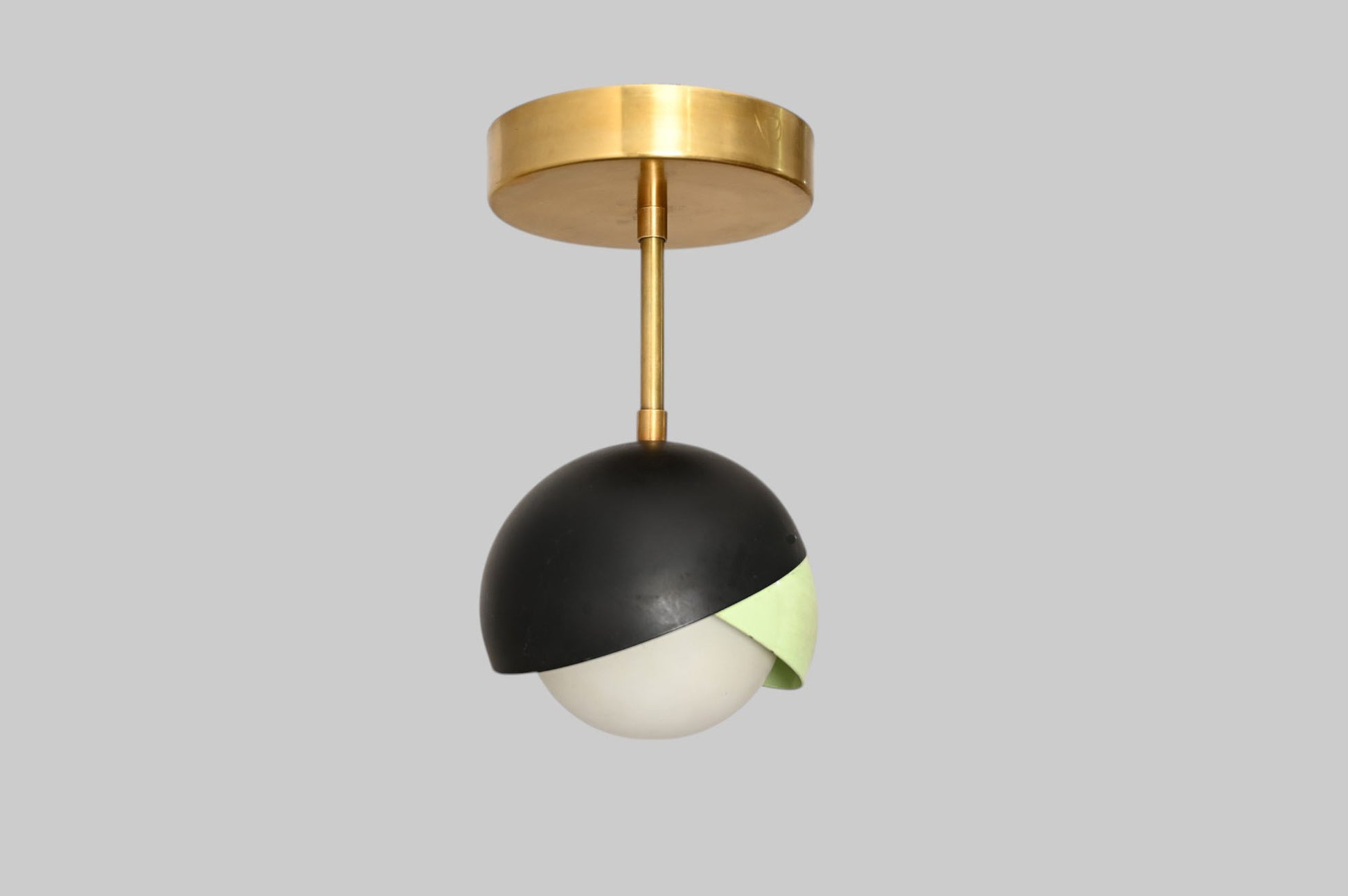 The 1-Light Mid-Century Ceiling Lamp features sleek design and retro flair for style