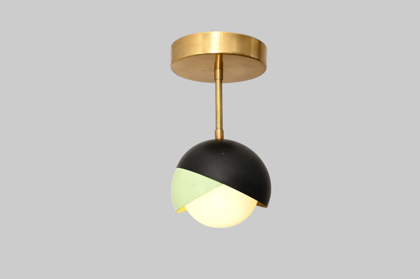 The 1-Light Mid-Century Ceiling Lamp features sleek design and retro flair for style