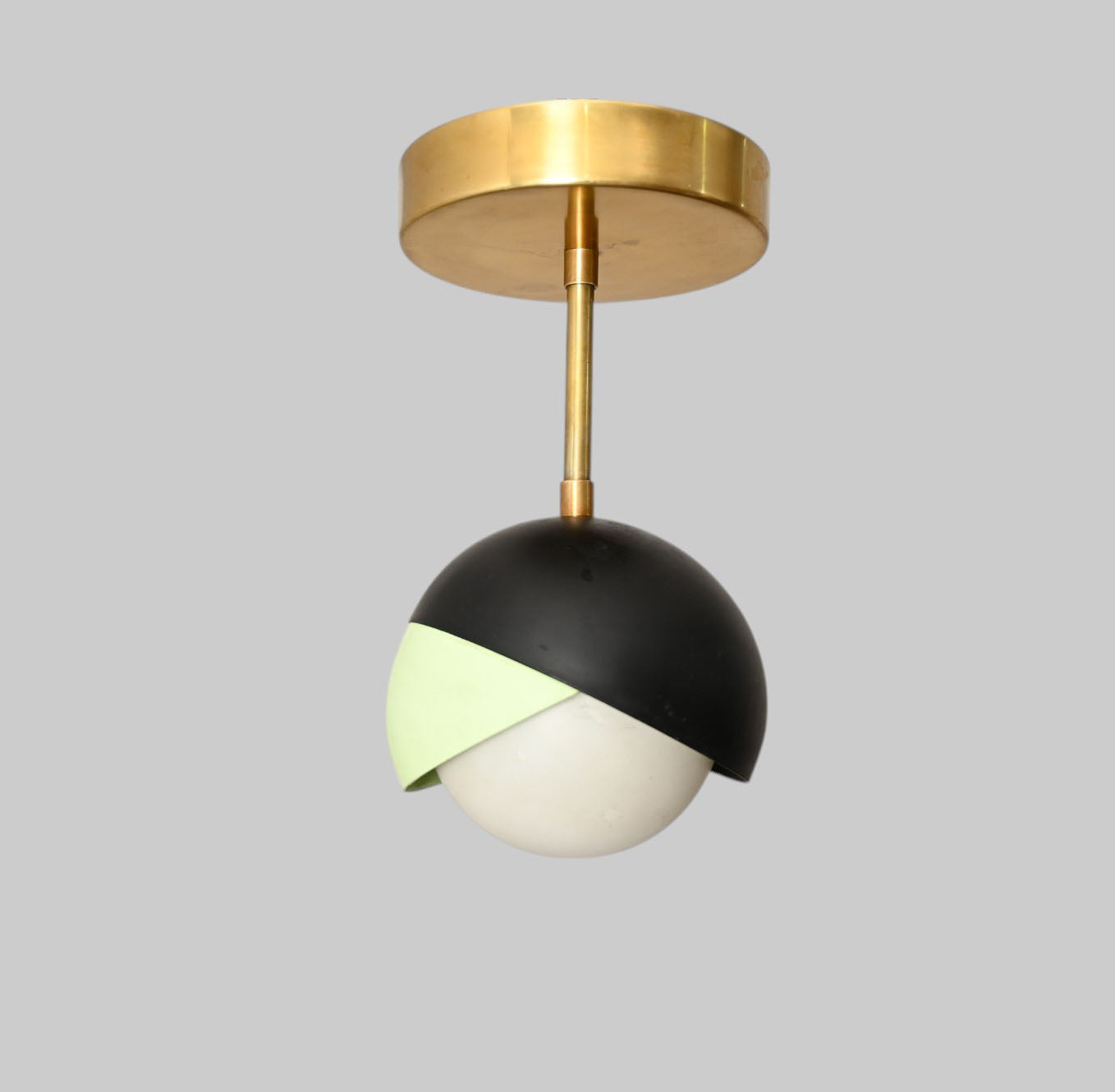 The 1-Light Mid-Century Ceiling Lamp features sleek design and retro flair for style