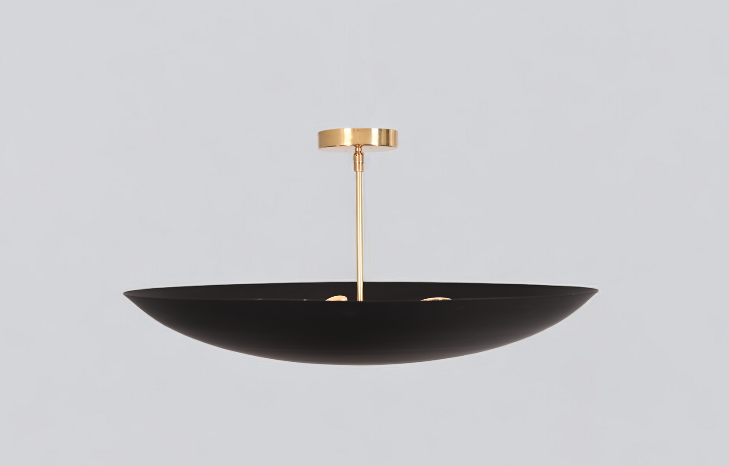 Add modern flair with a 6 Light Flush Mount Pendant, mid-century raw brass Sputnik design