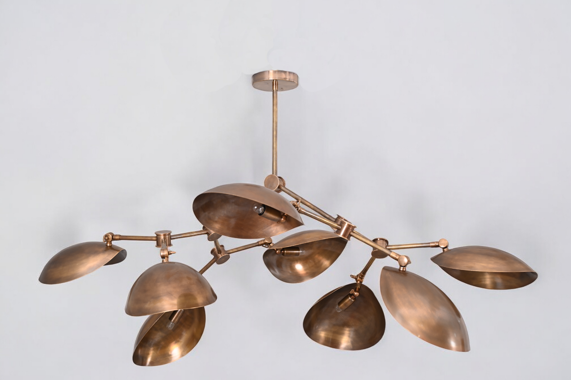 Brighten your space with the 8 Shade Light Mid Century Linear Brass Sputnik Chandelier