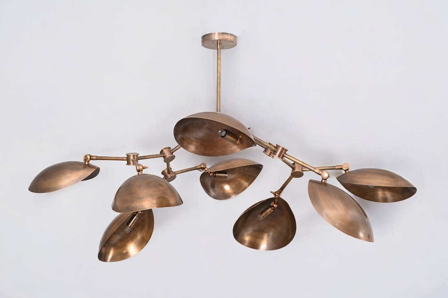 Brighten your space with the 8 Shade Light Mid Century Linear Brass Sputnik Chandelier