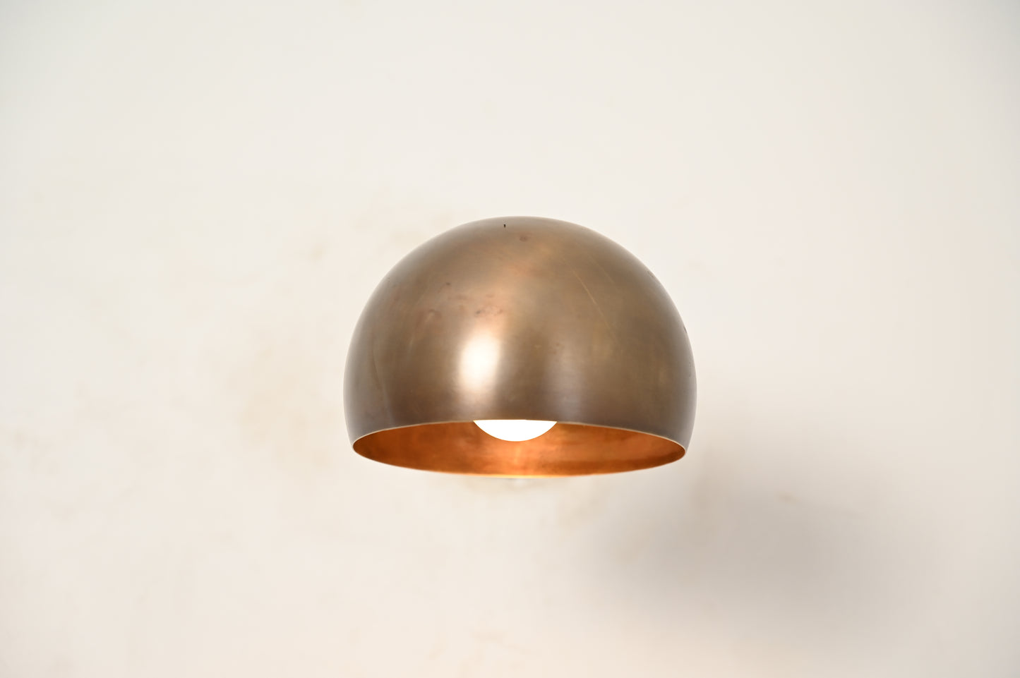 Illuminate your space with our 1-Light Mid-Century Wall Sconce in Raw Brass—elegant