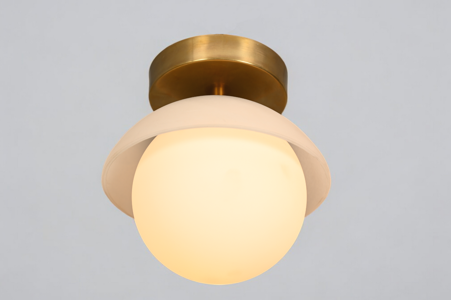 Brighten your space with the Mid-Century Brass Sputnik Ceiling Light and glass cone