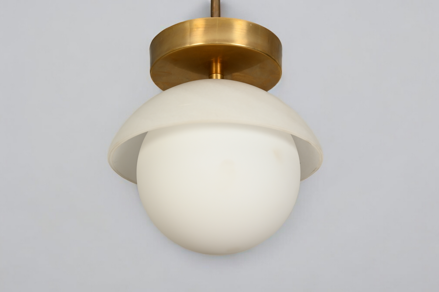 Brighten your space with the Mid-Century Brass Sputnik Ceiling Light and glass cone