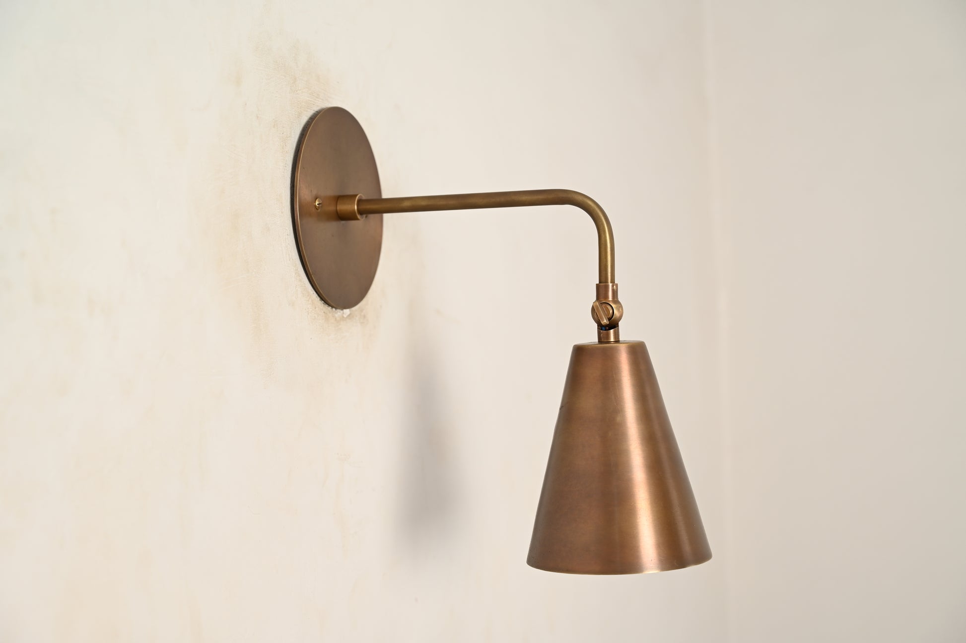 The Swivel Wall Lamp has an adjustable arm, blending style with functionality