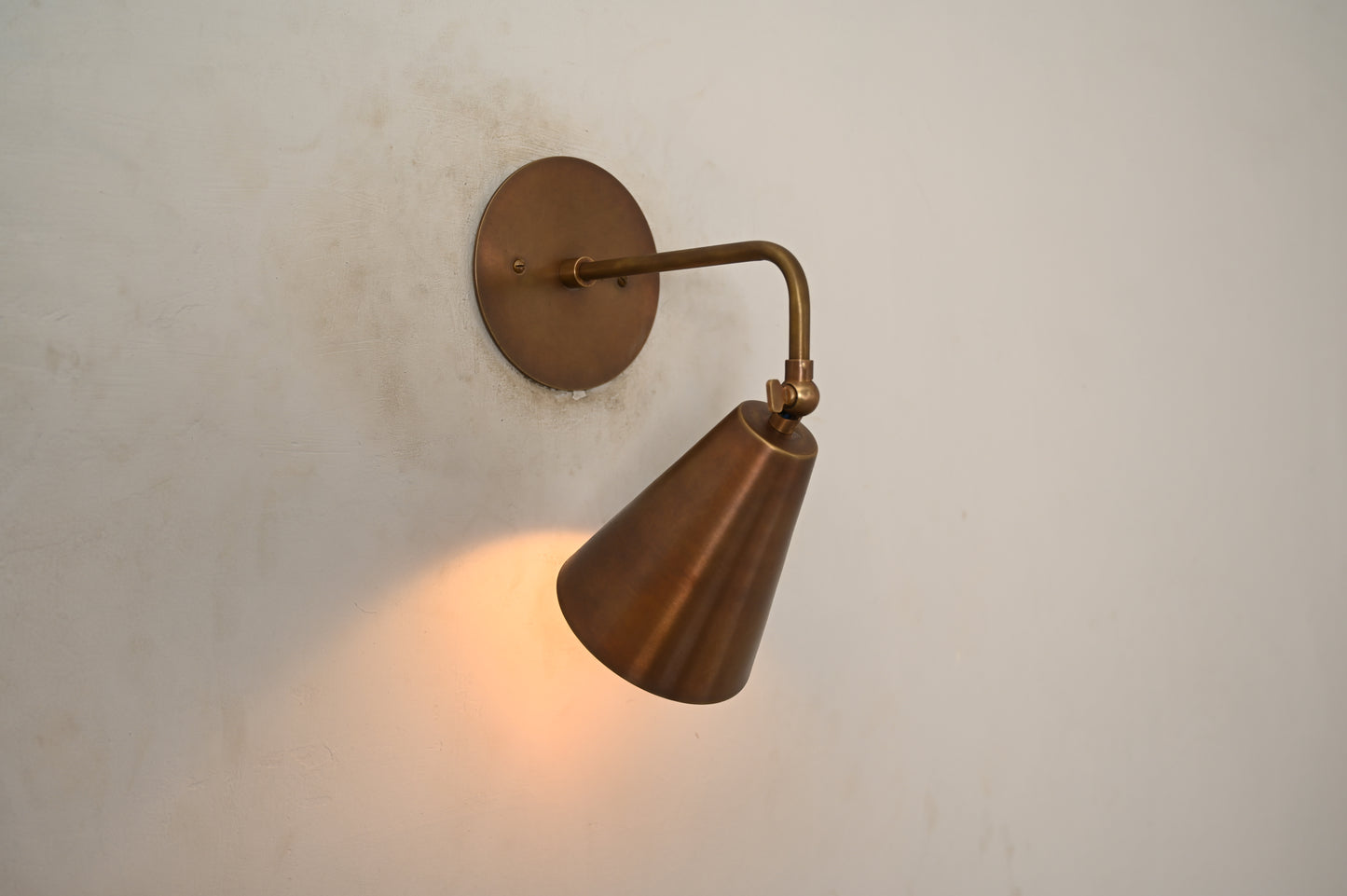 The Swivel Wall Lamp has an adjustable arm, blending style with functionality