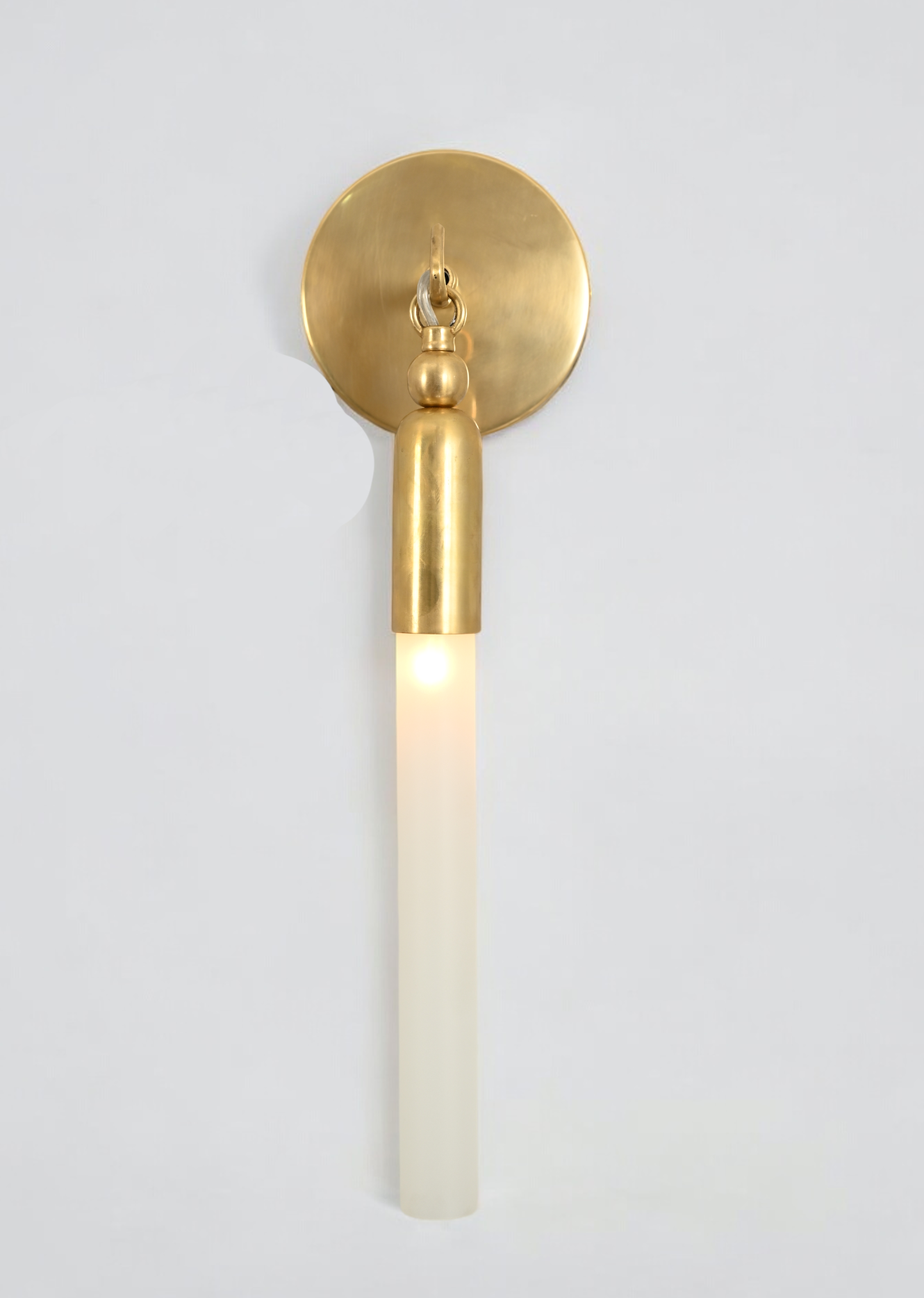 Illuminate your space with the TASSEL 1 Sconce—sleek glass tube and brass accents