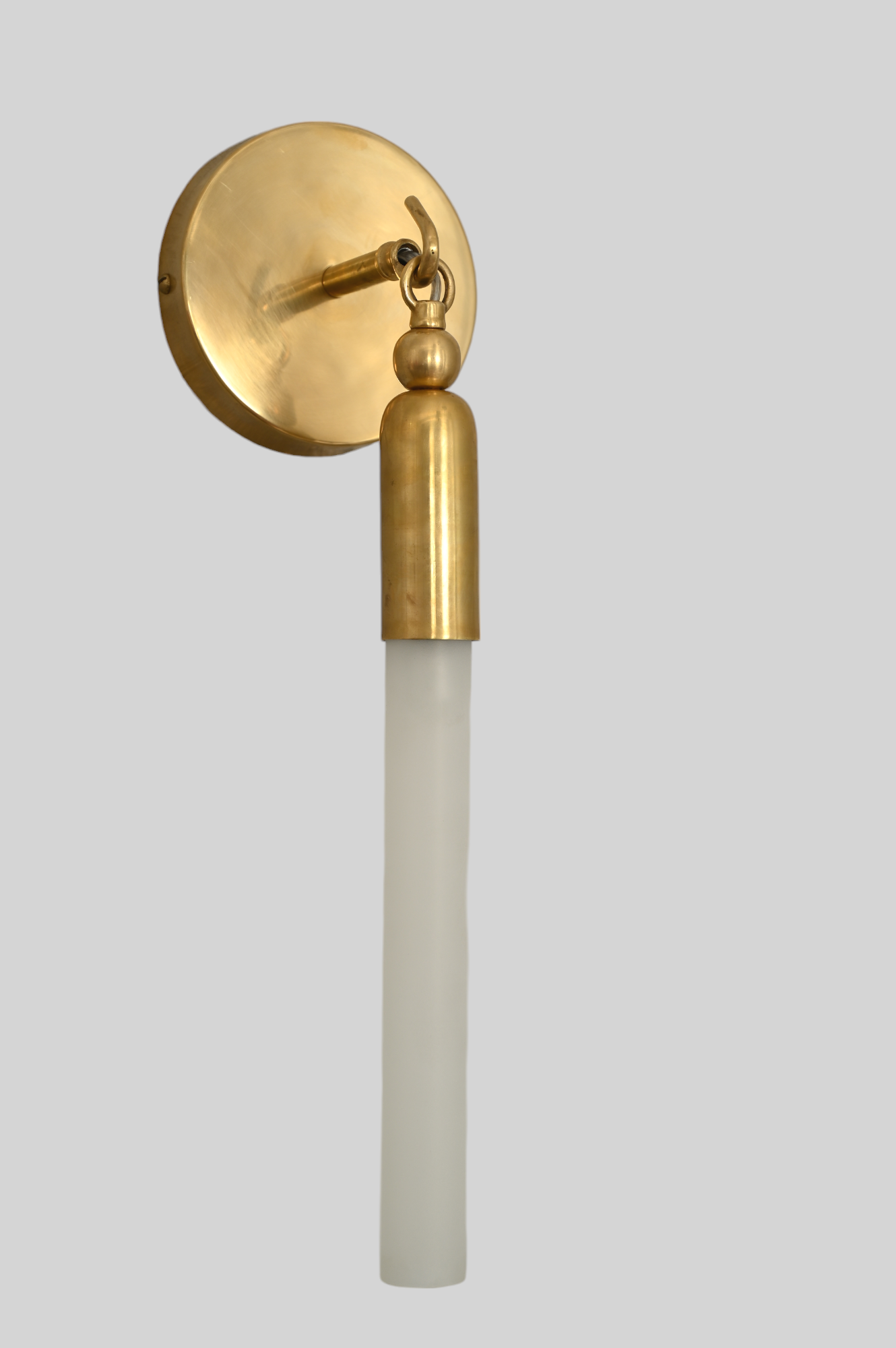 Illuminate your space with the TASSEL 1 Sconce—sleek glass tube and brass accents