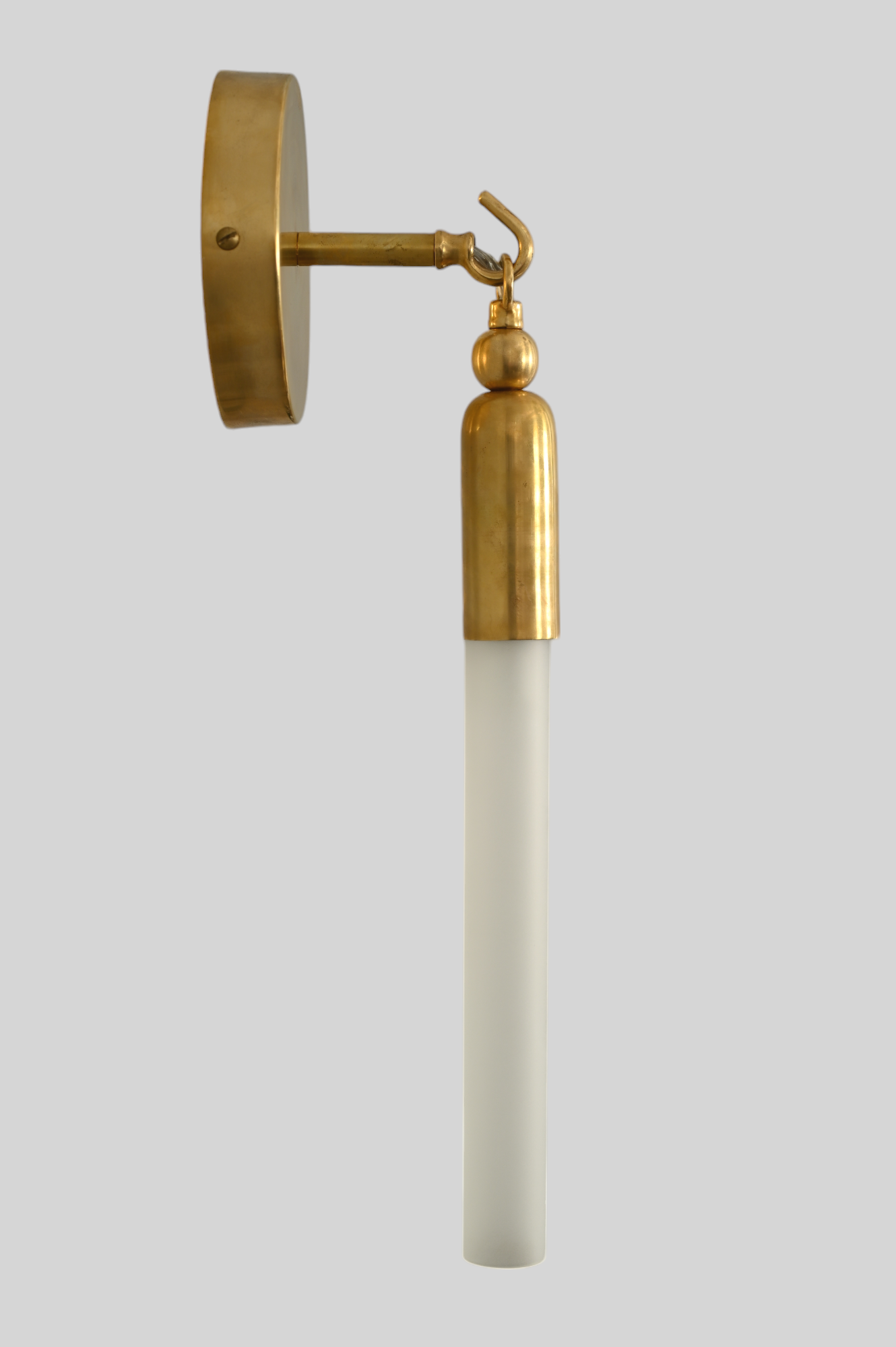 Illuminate your space with the TASSEL 1 Sconce—sleek glass tube and brass accents