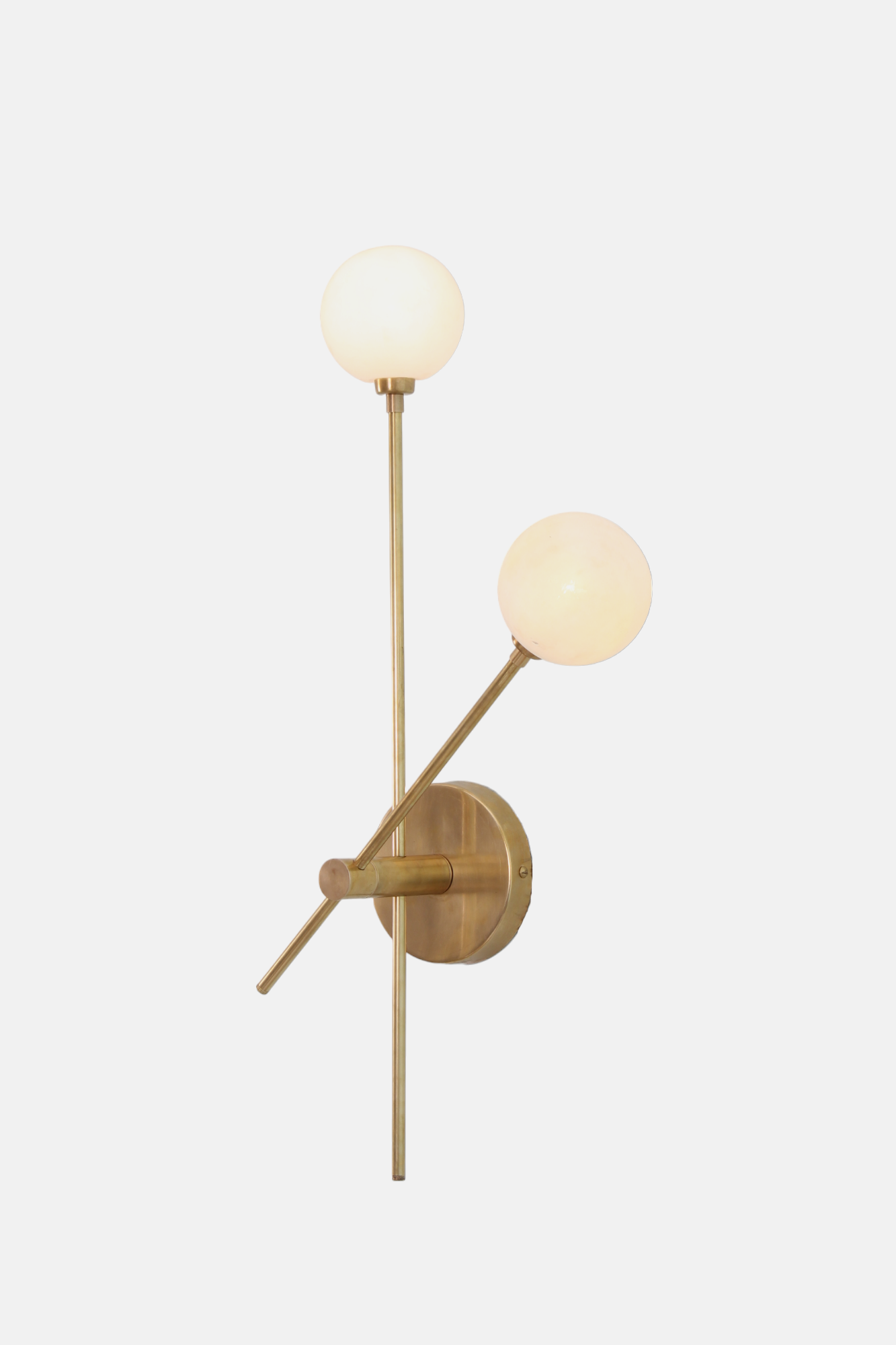 Brighten your space with the handcrafted Mid Century Raw Brass Wall Lamp and globe