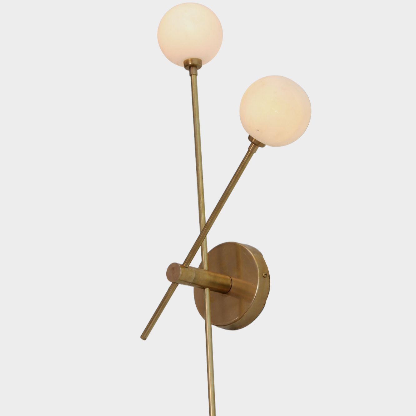 Brighten your space with the handcrafted Mid Century Raw Brass Wall Lamp and globe