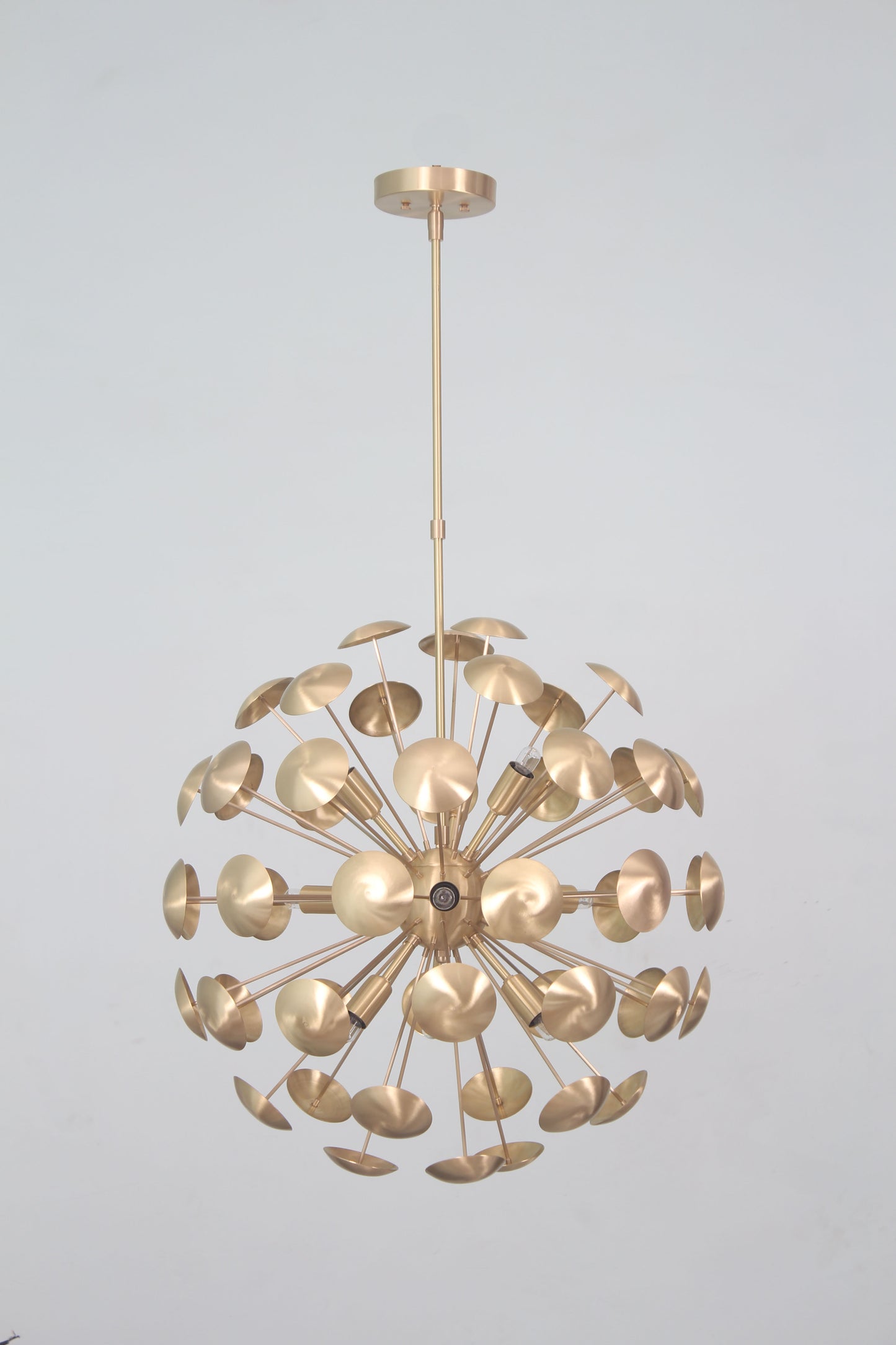 Elevate your space with the Mid-Century Nine Light Brass Sputnik Chandelier