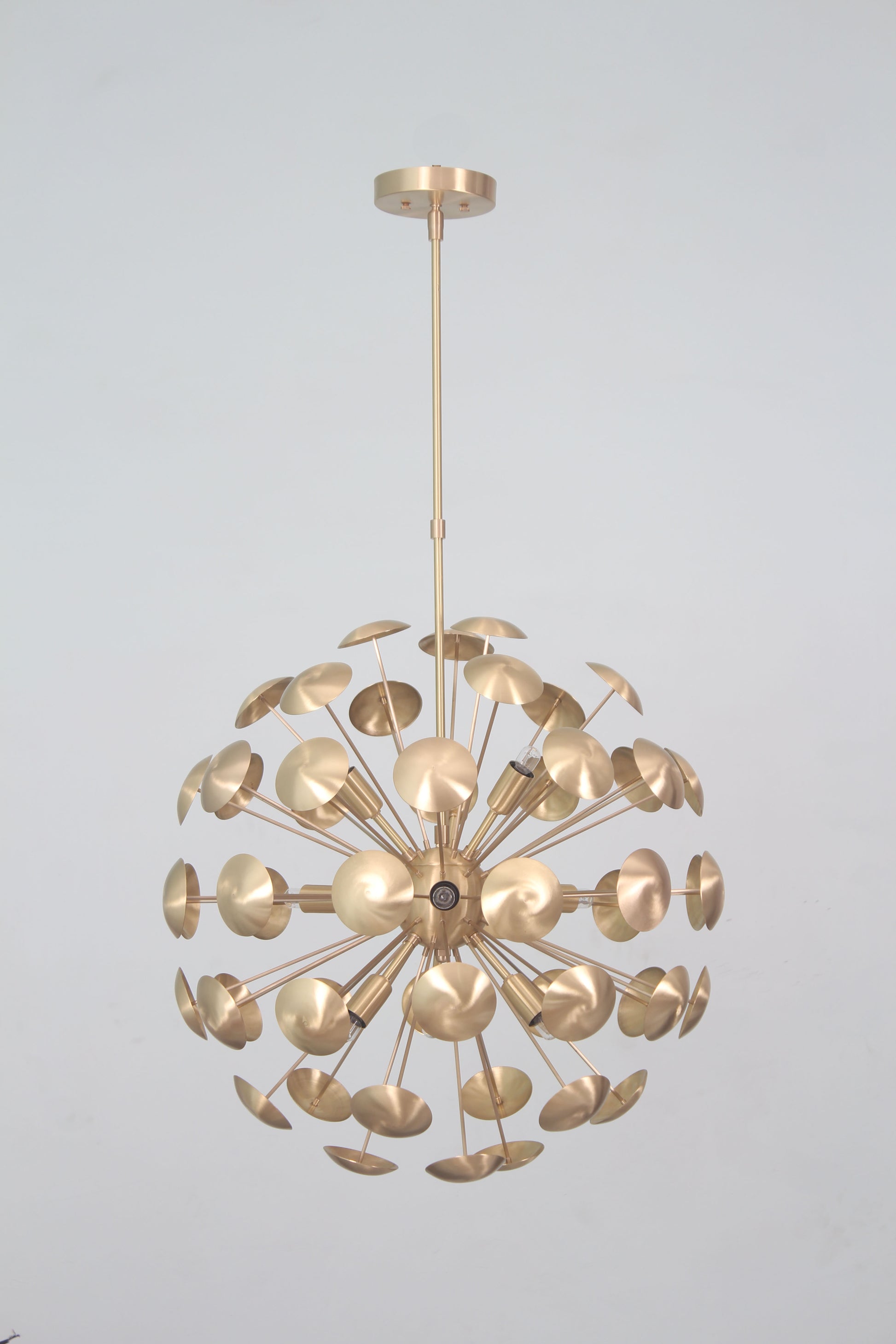 Elevate your space with the Mid-Century Nine Light Brass Sputnik Chandelier