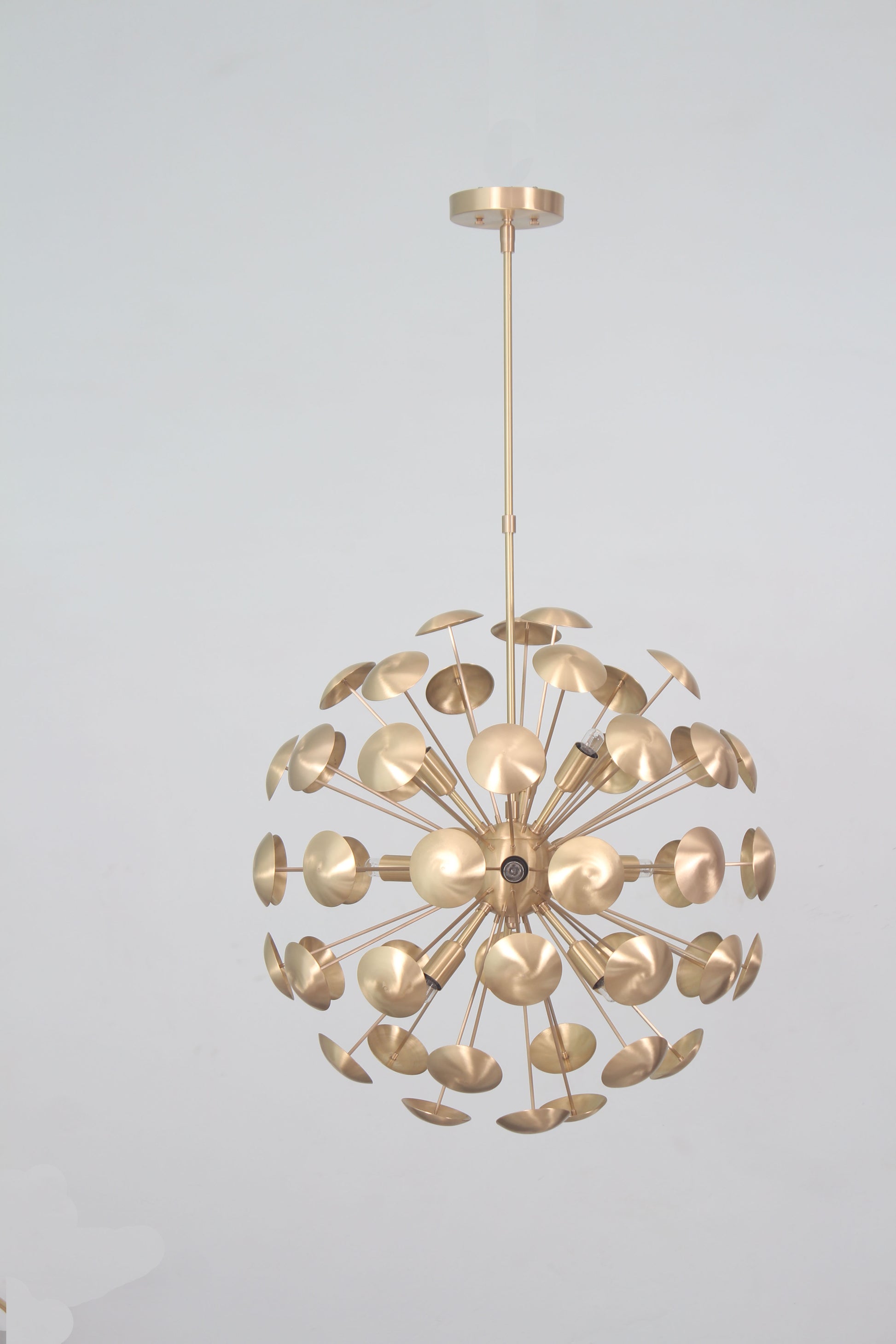 Elevate your space with the Mid-Century Nine Light Brass Sputnik Chandelier