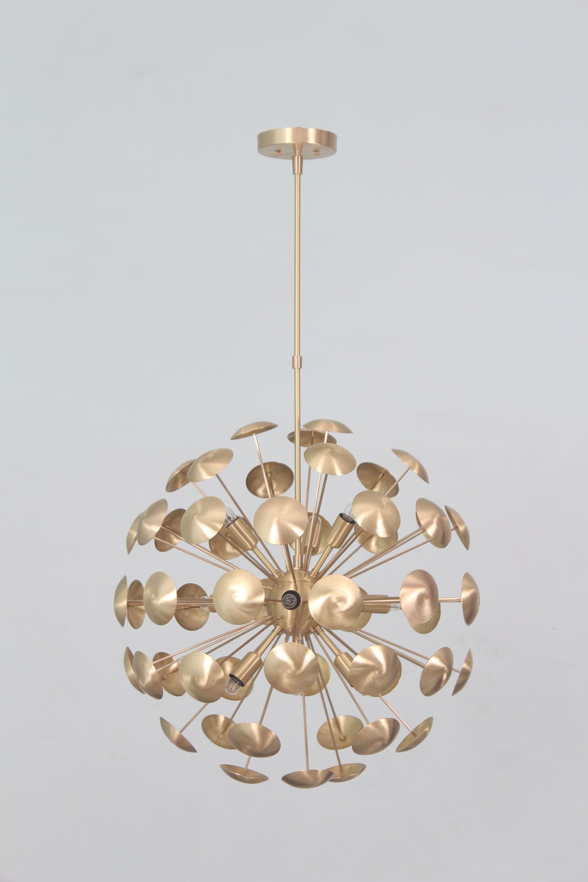 Elevate your space with the Mid-Century Nine Light Brass Sputnik Chandelier