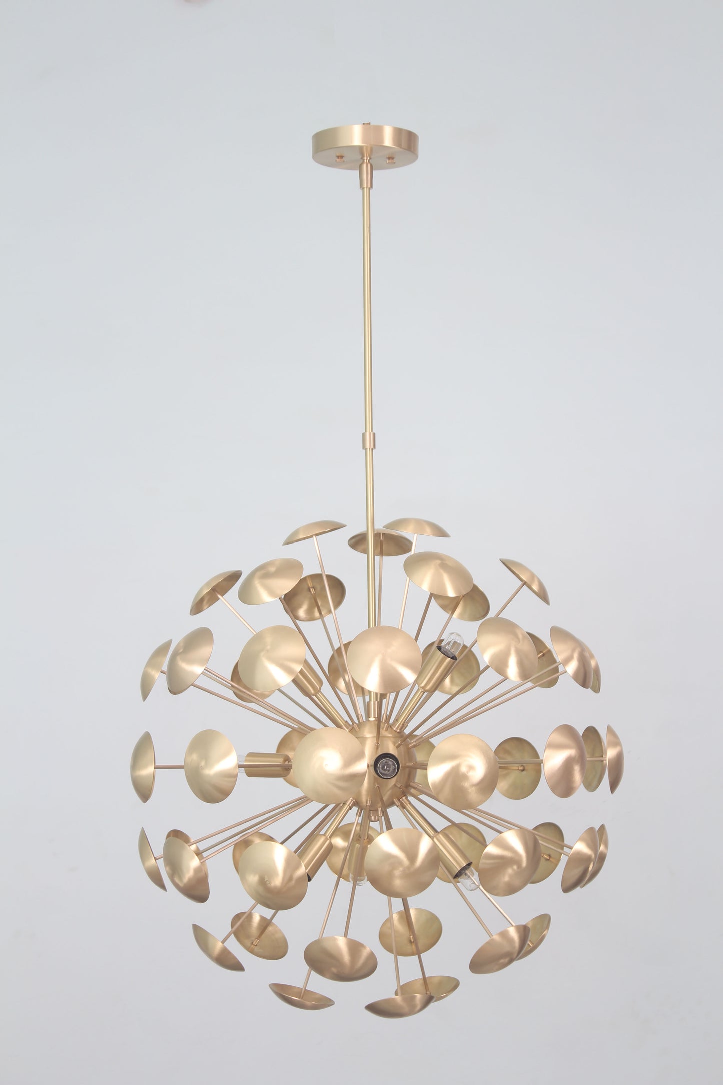 Elevate your space with the Mid-Century Nine Light Brass Sputnik Chandelier