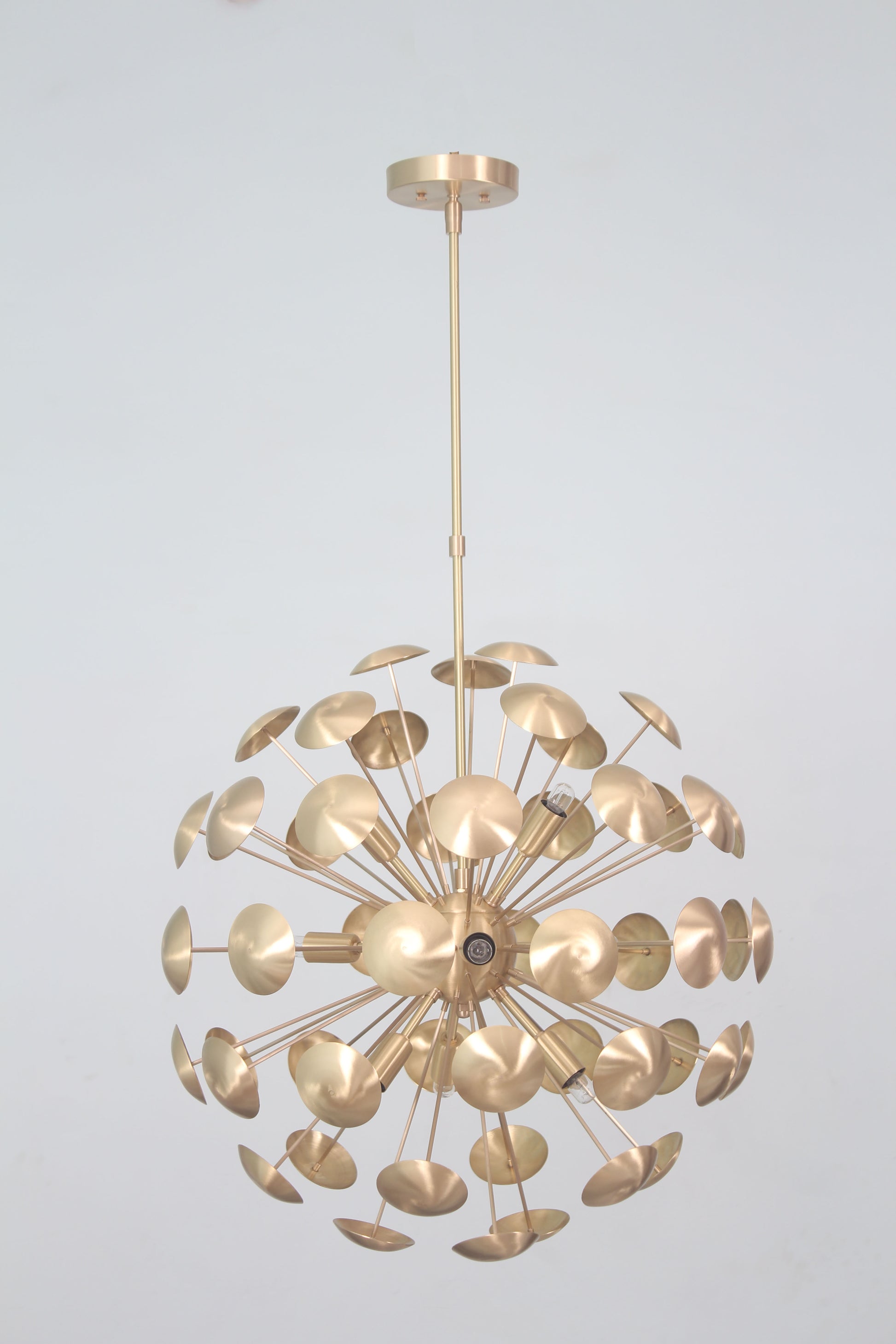 Elevate your space with the Mid-Century Nine Light Brass Sputnik Chandelier