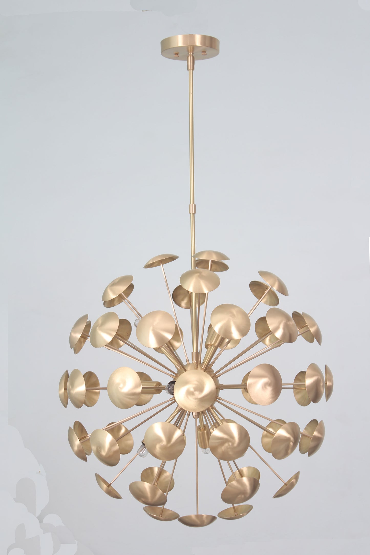 Elevate your space with the Mid-Century Nine Light Brass Sputnik Chandelier