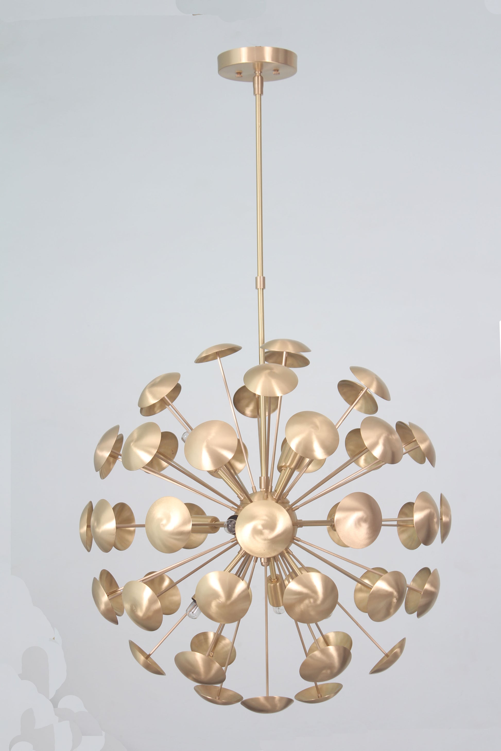 Elevate your space with the Mid-Century Nine Light Brass Sputnik Chandelier