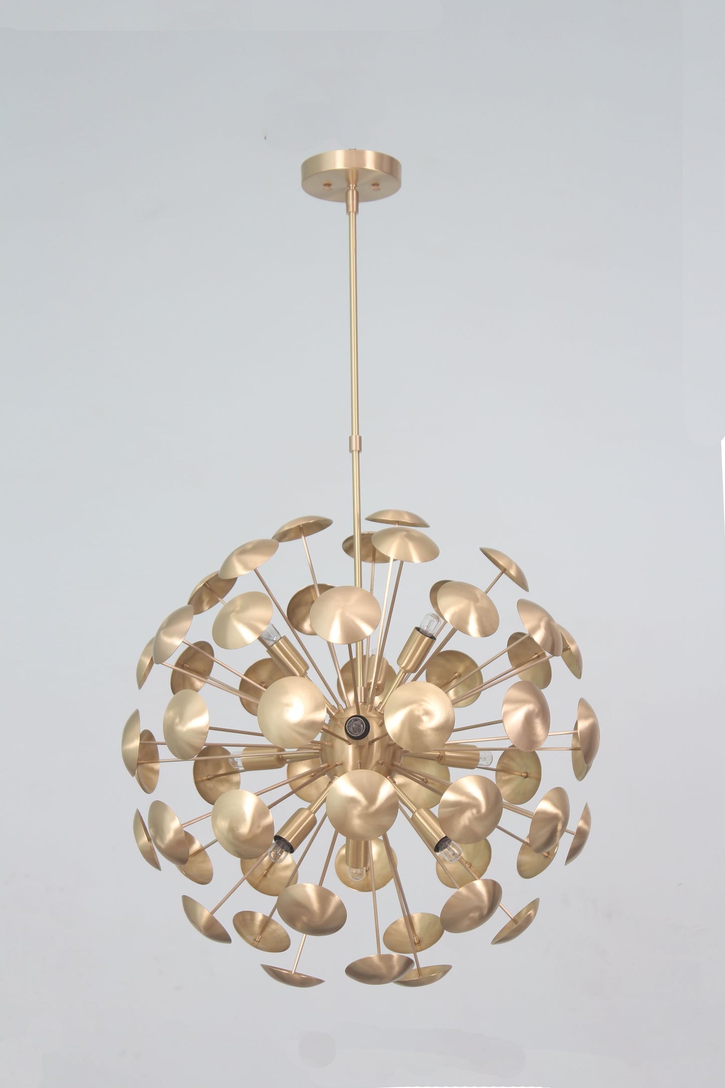 Elevate your space with the Mid-Century Nine Light Brass Sputnik Chandelier