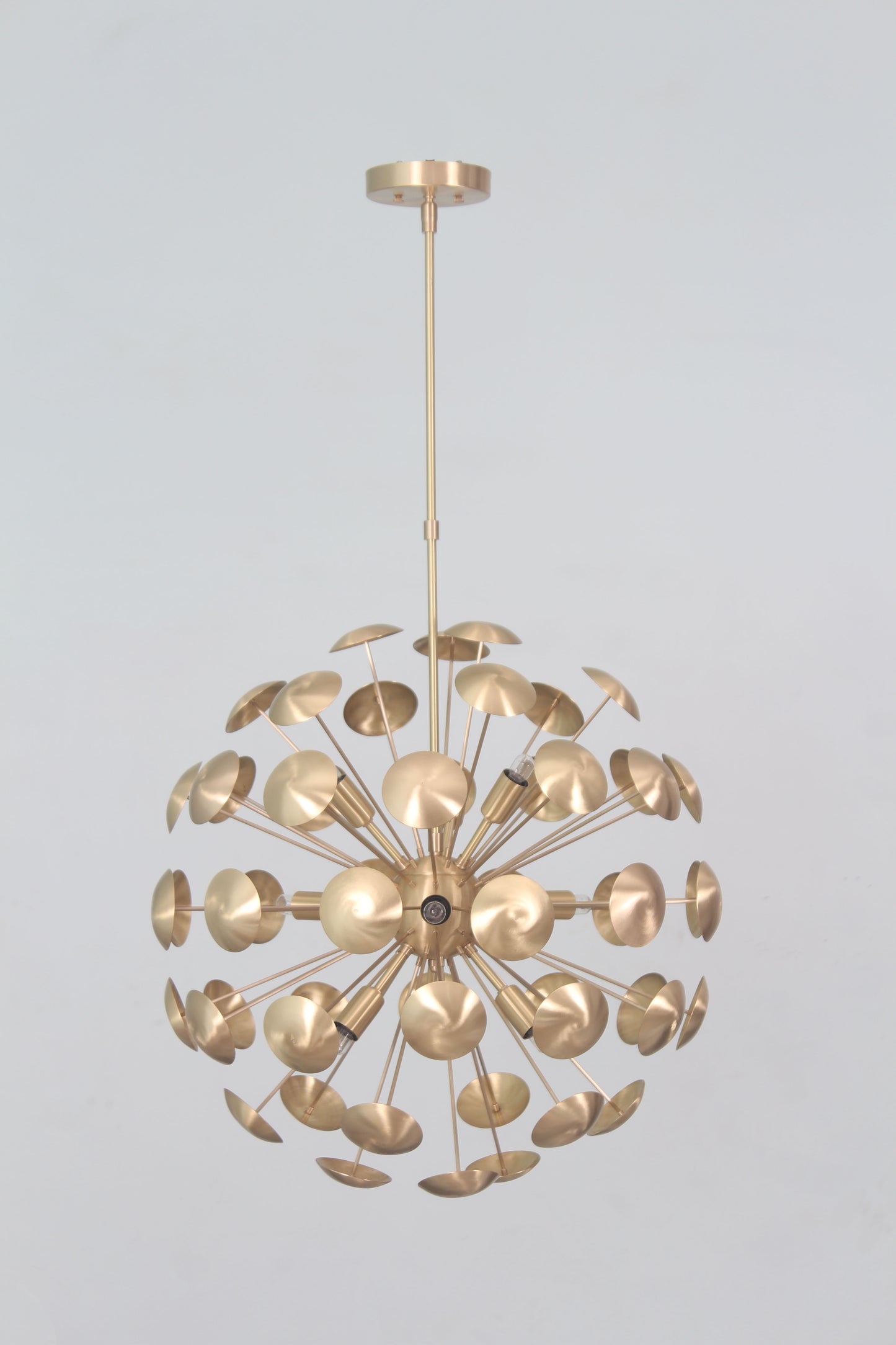 Elevate your space with the Mid-Century Nine Light Brass Sputnik Chandelier