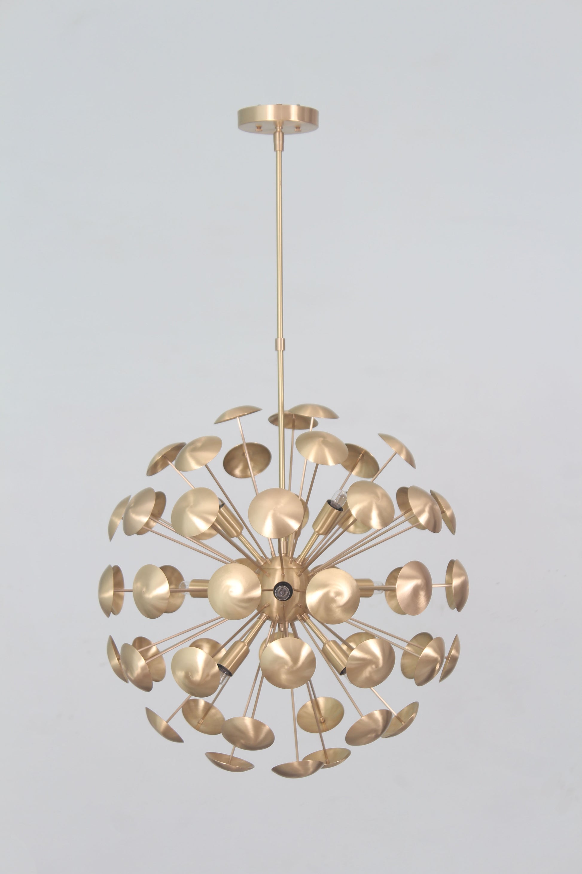 Elevate your space with the Mid-Century Nine Light Brass Sputnik Chandelier