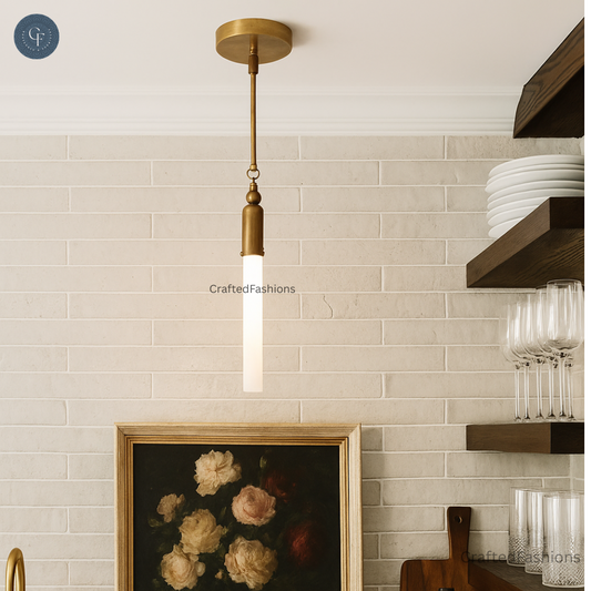 Modern brass tube pendant with opal glass shade adds sleek, minimalist elegance