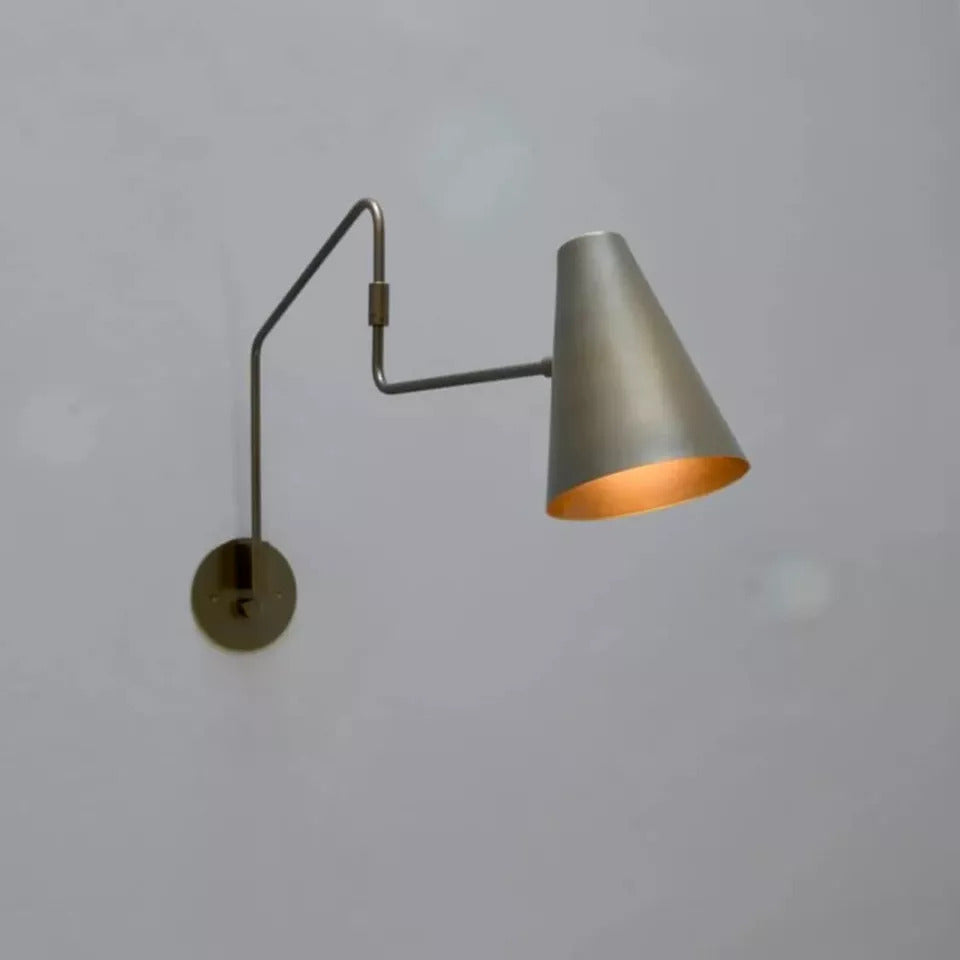 Moveable wall lamp offers flexible lighting with adjustable angle and direction.